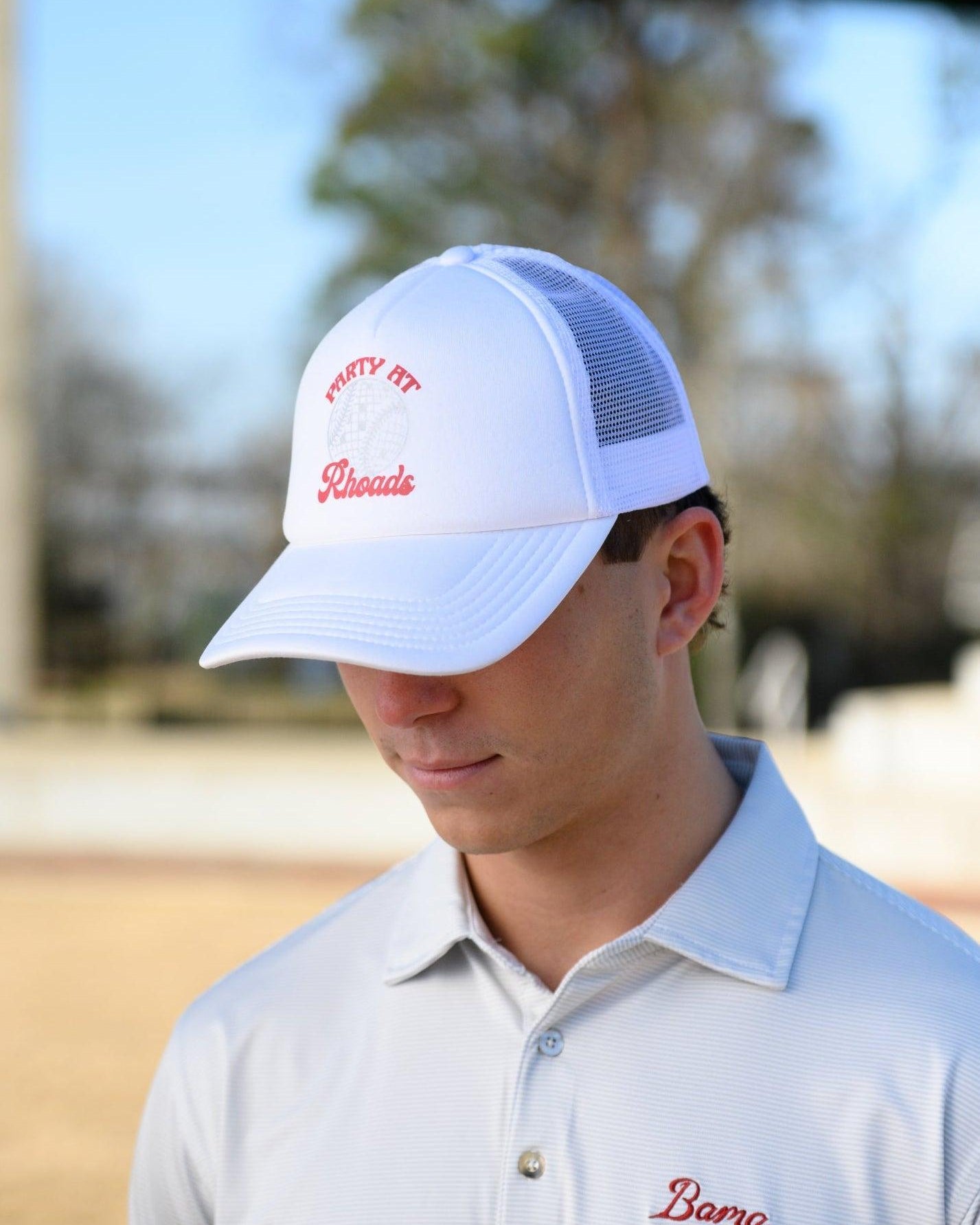 University of Alabama White Trucker Hat with Red “Party At Rhoads” text and a disco softball design in silver.