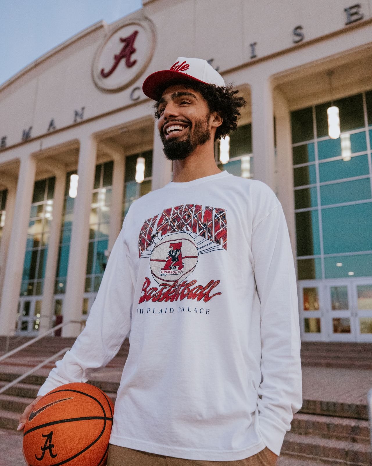 University of Alabama White T-Shirt with Plaid text “Alabama” above a Vintage A Logo Basketball and Red text “Basketball” underneath, with Black text “The Plaid Palace” across the bottom of the design
