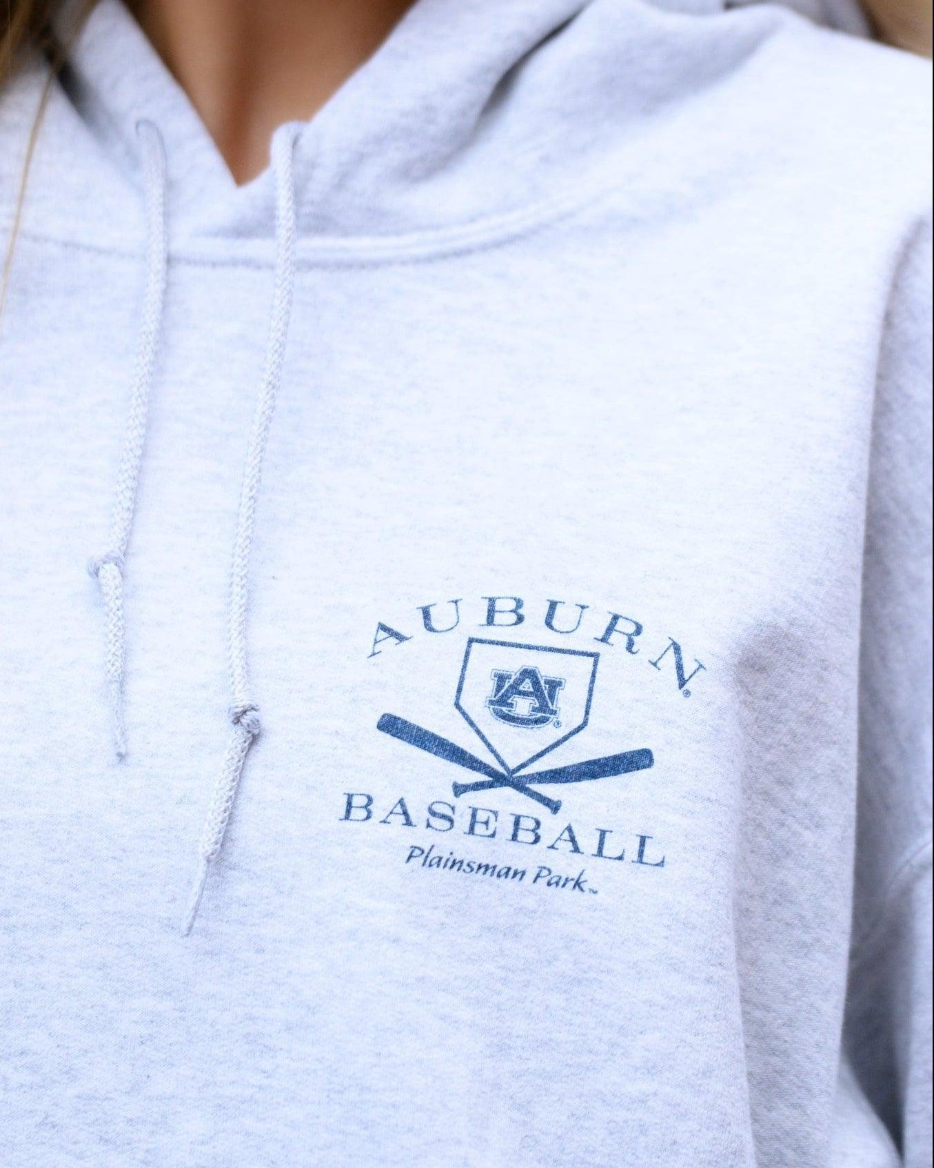 Auburn University Light Grey Distressed Hoodie Chest Design with a Navy print of home plate over two crossed baseball bats