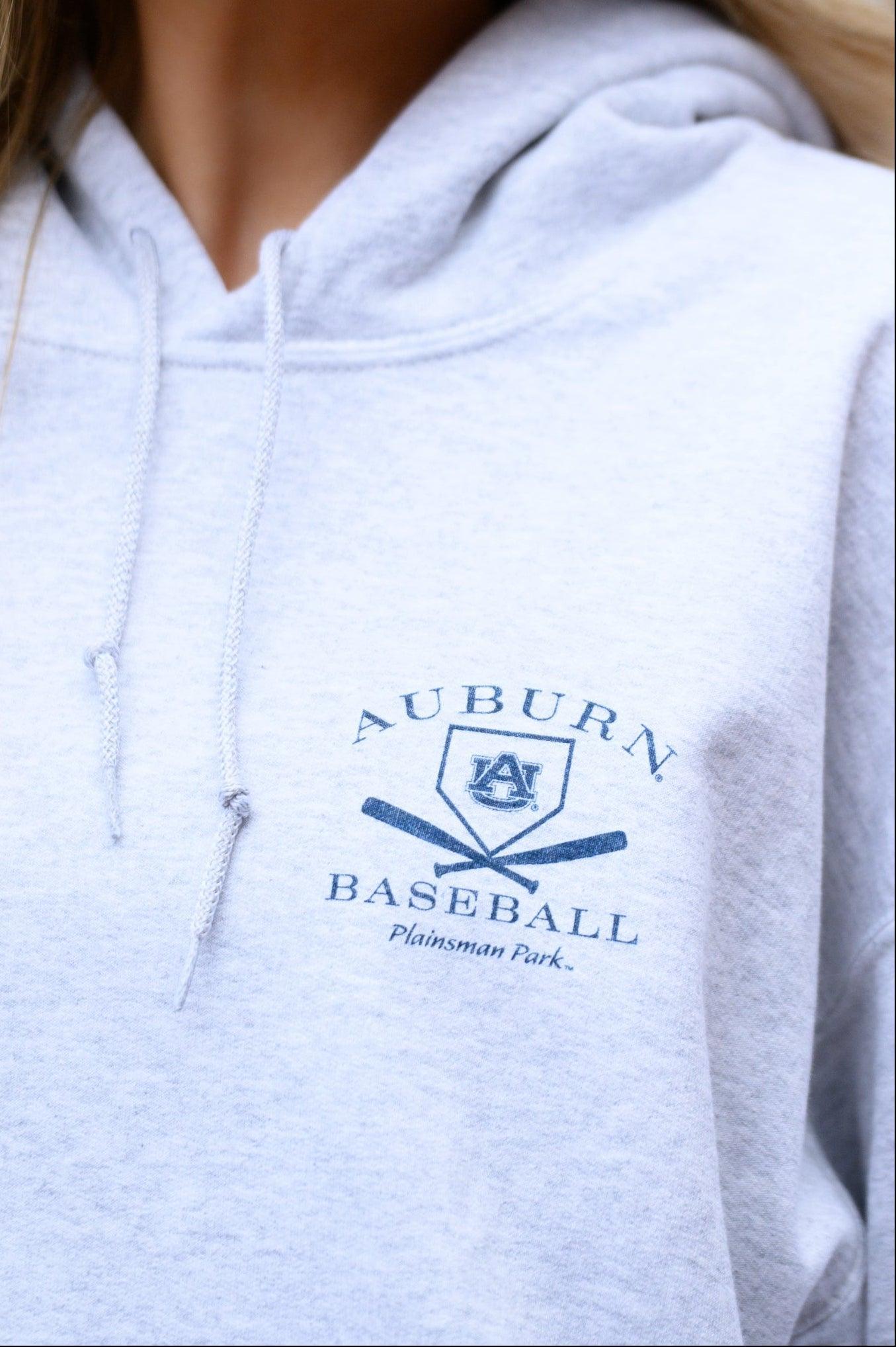 Auburn University Light Grey Distressed Hoodie Chest Design with a Navy print of home plate over two crossed baseball bats