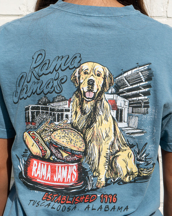 Person wearing a blue t-shirt with a graphic of a dog and hot dogs, featuring 'Rama Jim's' branding.
