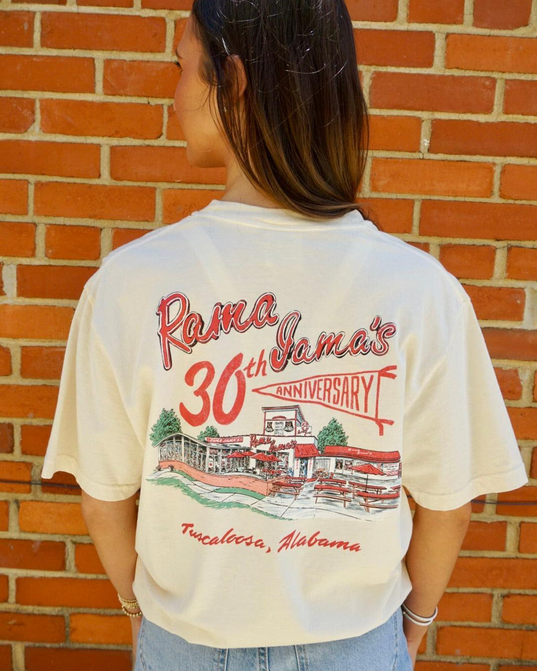 Rama Jama’s Ivory T-Shirt with the Rama Jama’s Building under Red text “Rama Jama’s 30th anniversary” with “anniversary” inside a pennant flag