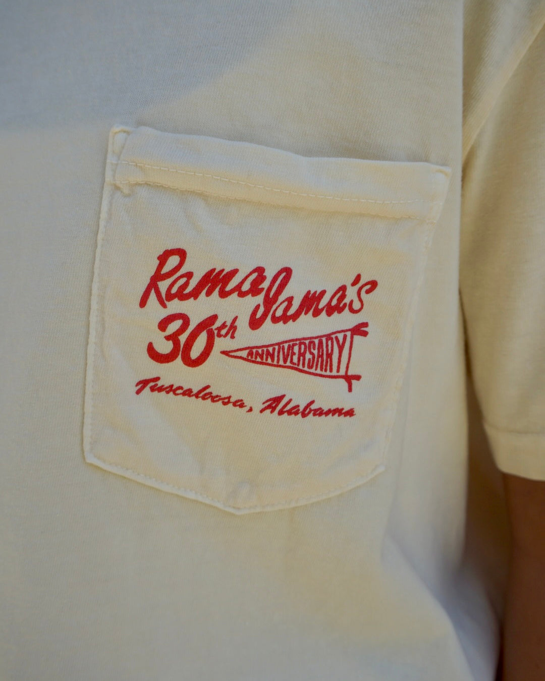 Front Pocket with Red text “Rama Jama’s 30th anniversary” with “anniversary” inside a pennant flag