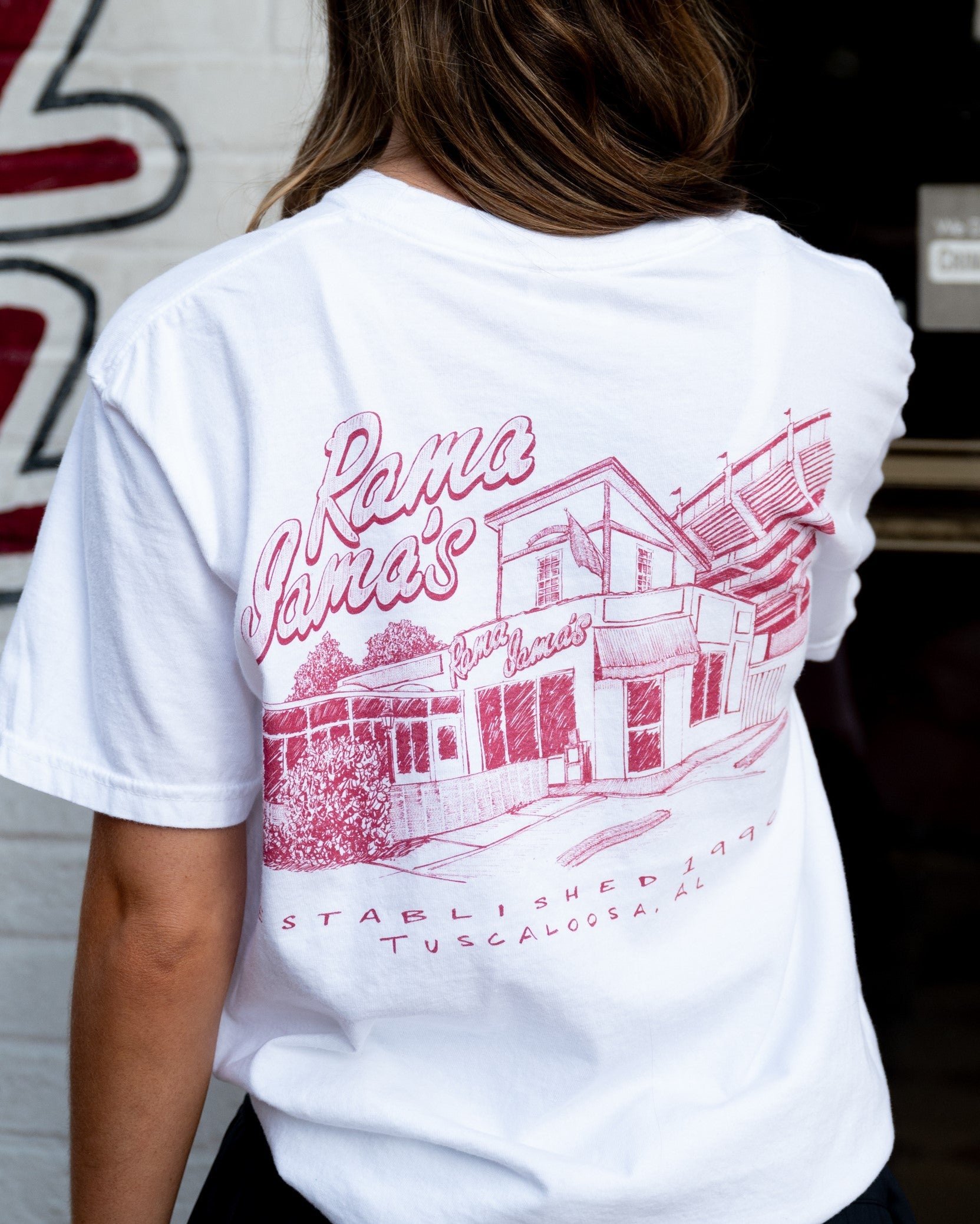 Rama Jama's White Tee with a Red illustration of the Rama Jama's Building