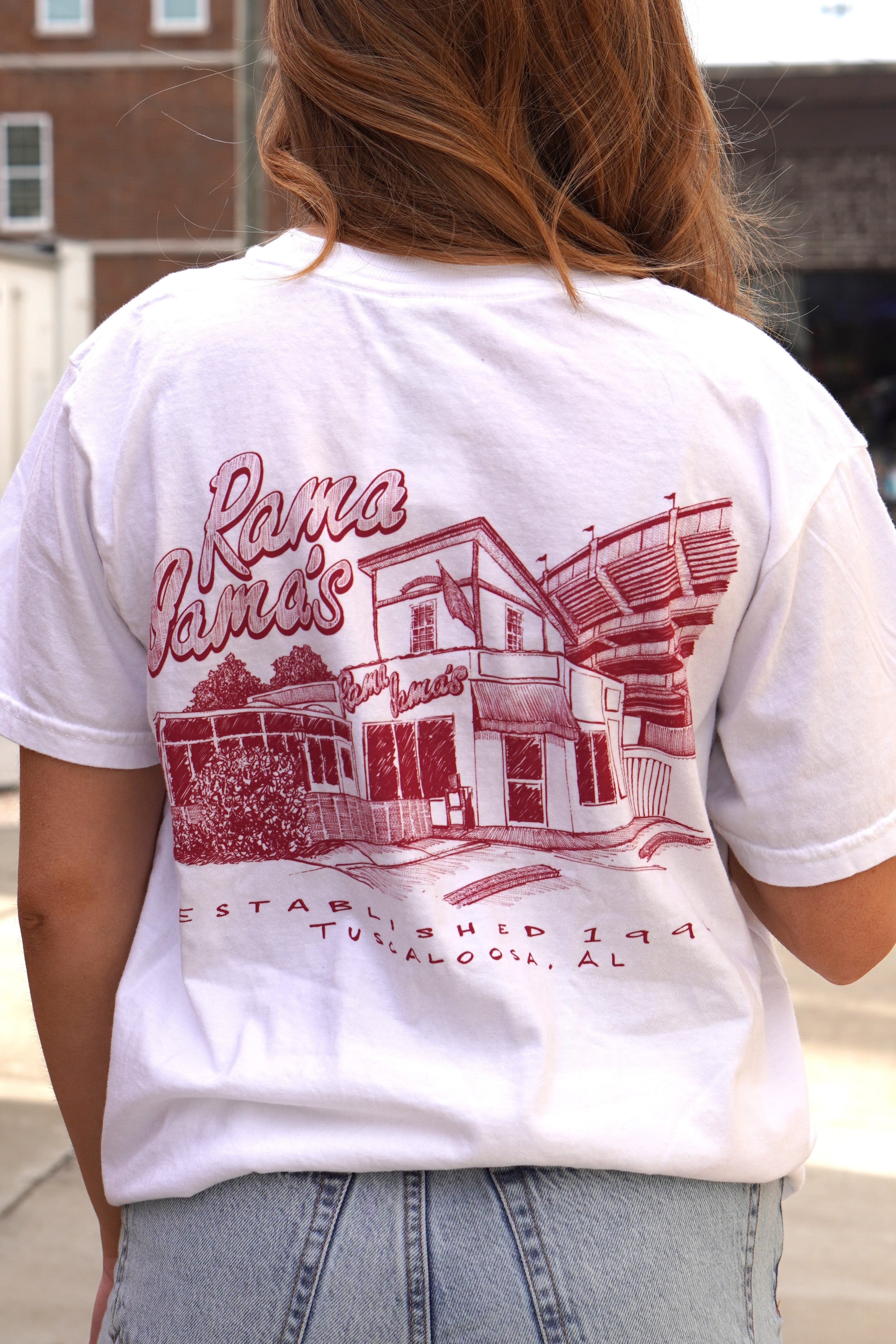Rama Jama's White Tee with a Red illustration of the Rama Jama's Building