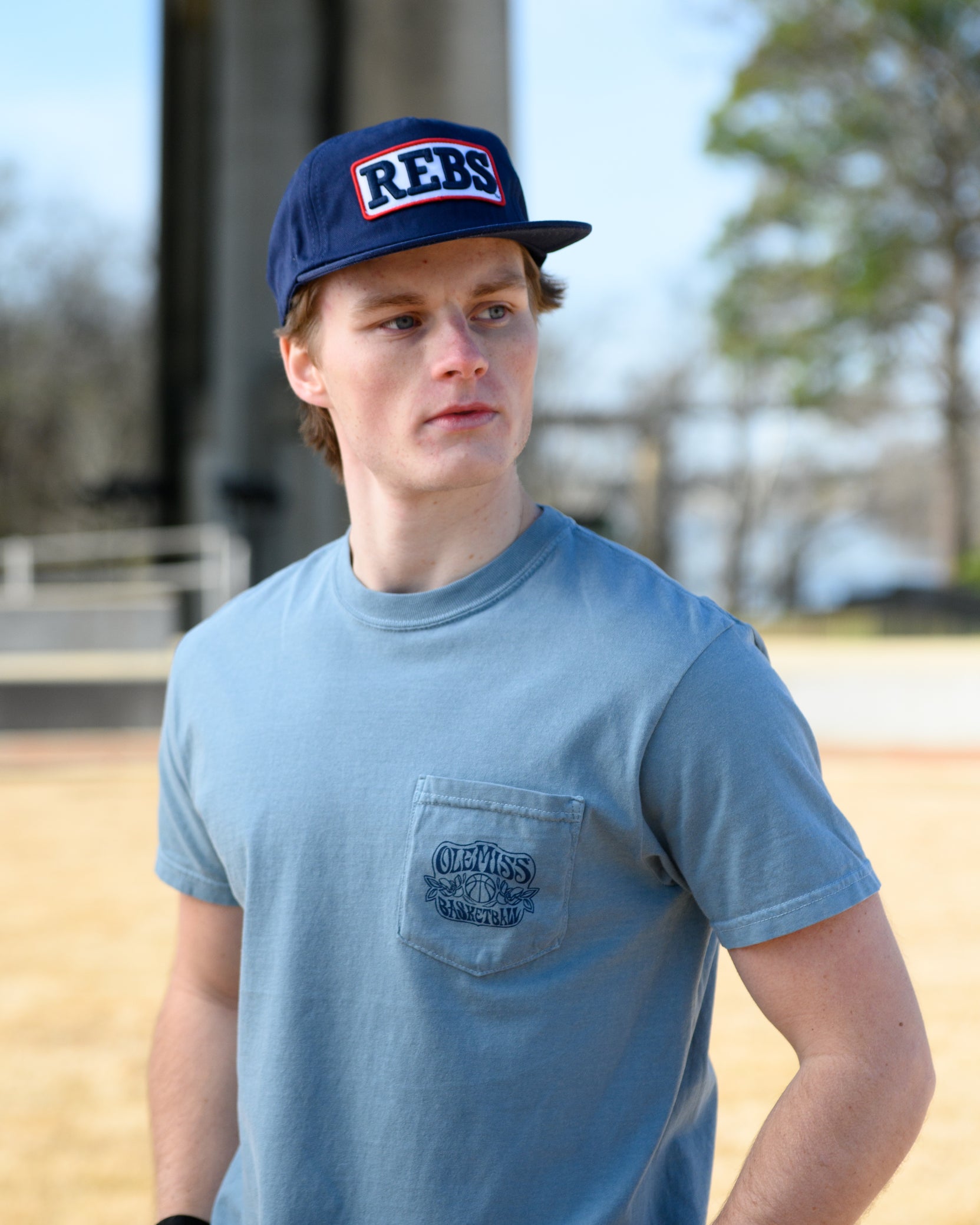 Ole Miss Blue T-Shirt with an "Ole Miss Basketball" front pocket design