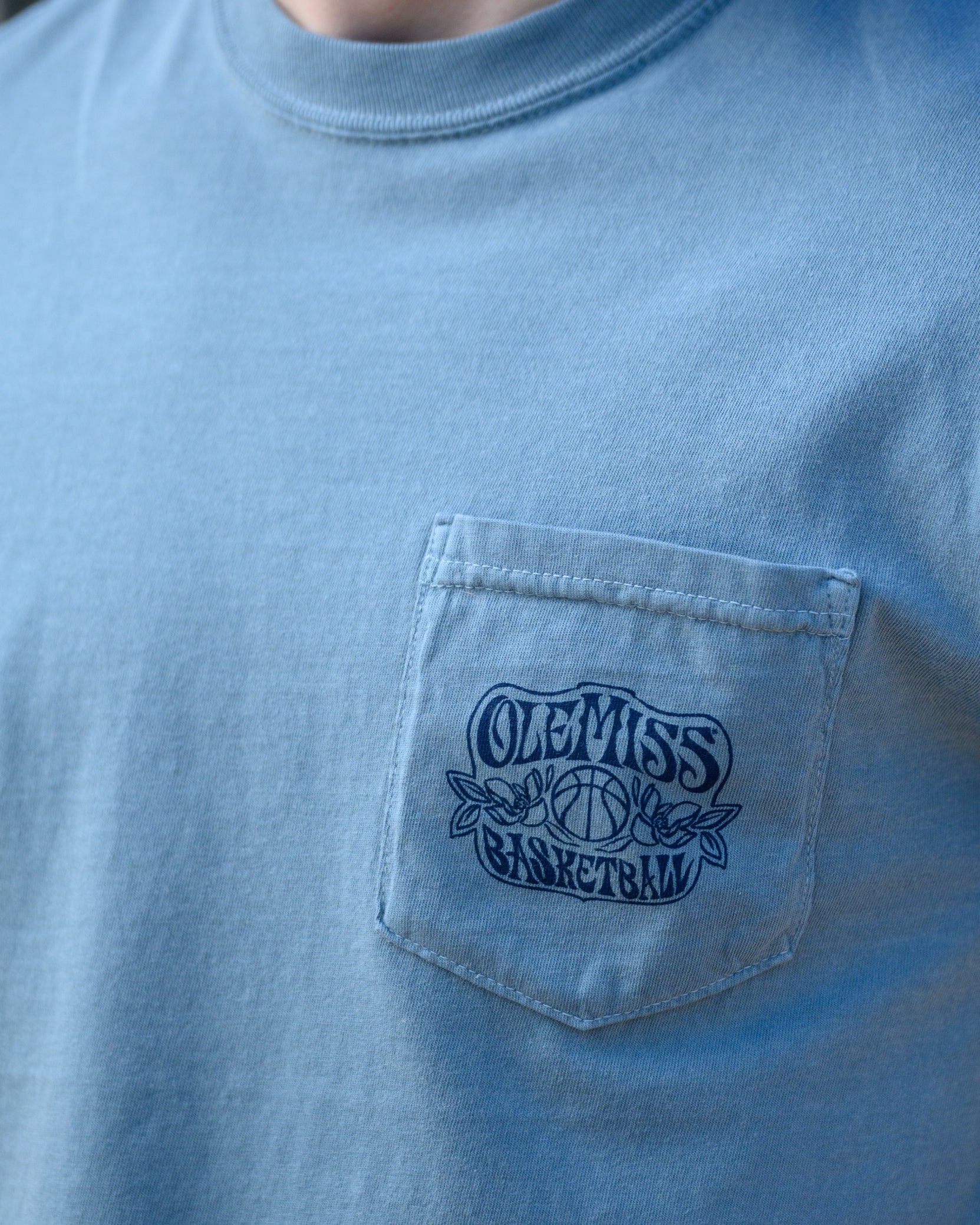 Ole Miss Blue T-Shirt with an "Ole Miss Basketball" front pocket design
