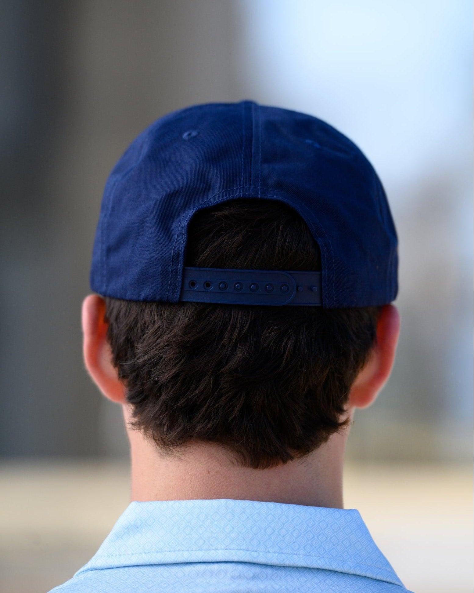 Ole Miss Navy Snapback Hat featuring a White patch with Navy “REBS” embroidery snapback hat