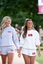 University of Alabama White Roll Tide Shorts featuring a Red and White embroidered patch with text "Roll Tide!"
