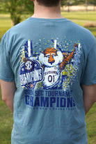 Auburn University Ice Blue SEC Champions T-Shirt with an illustration of Aubie holding an "SEC Champions" sign while confetti pours down around him