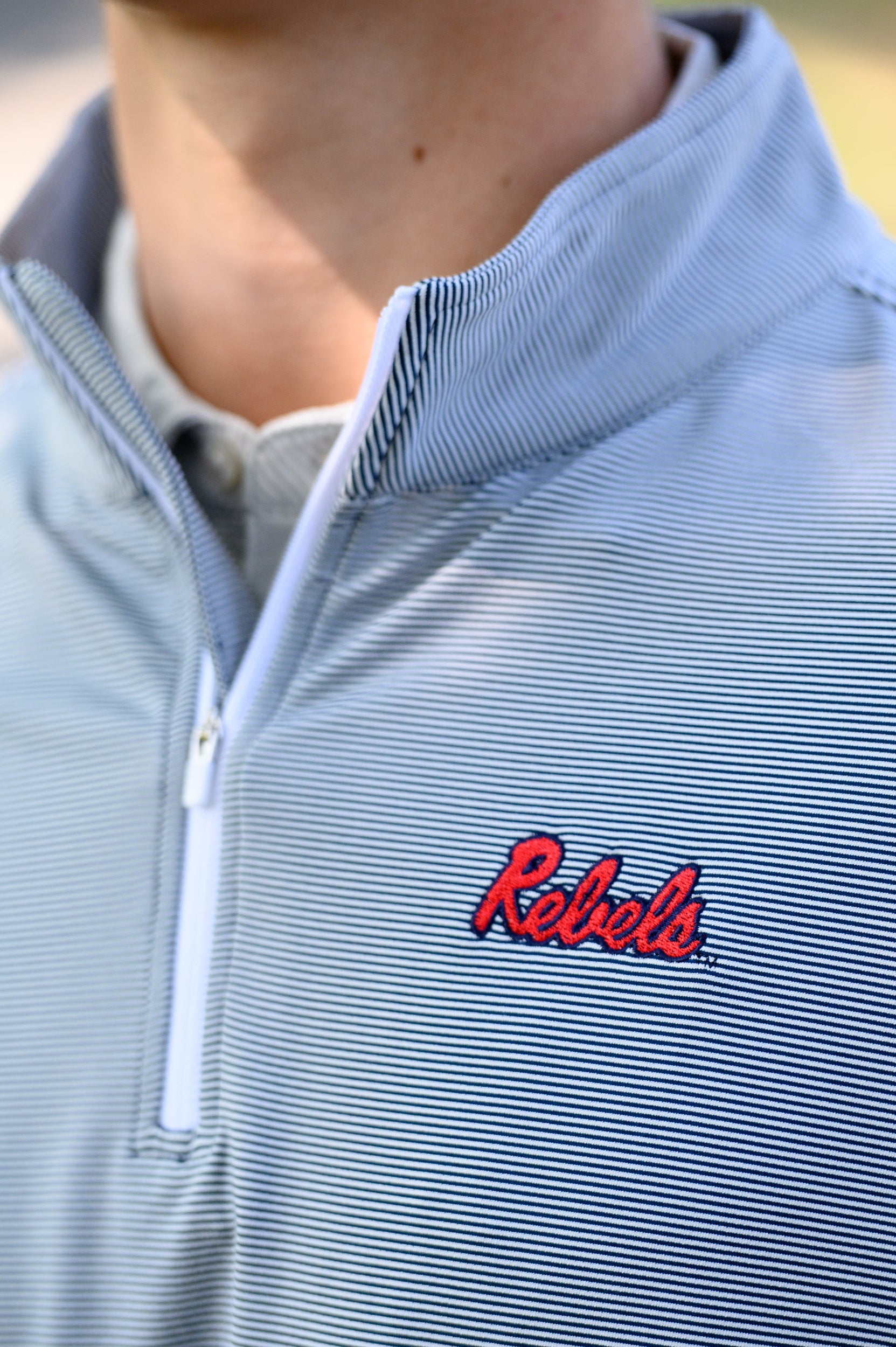 Ole Miss Navy Stripe ¼ Zip Pullover with the Script “Rebels” Logo embroidery