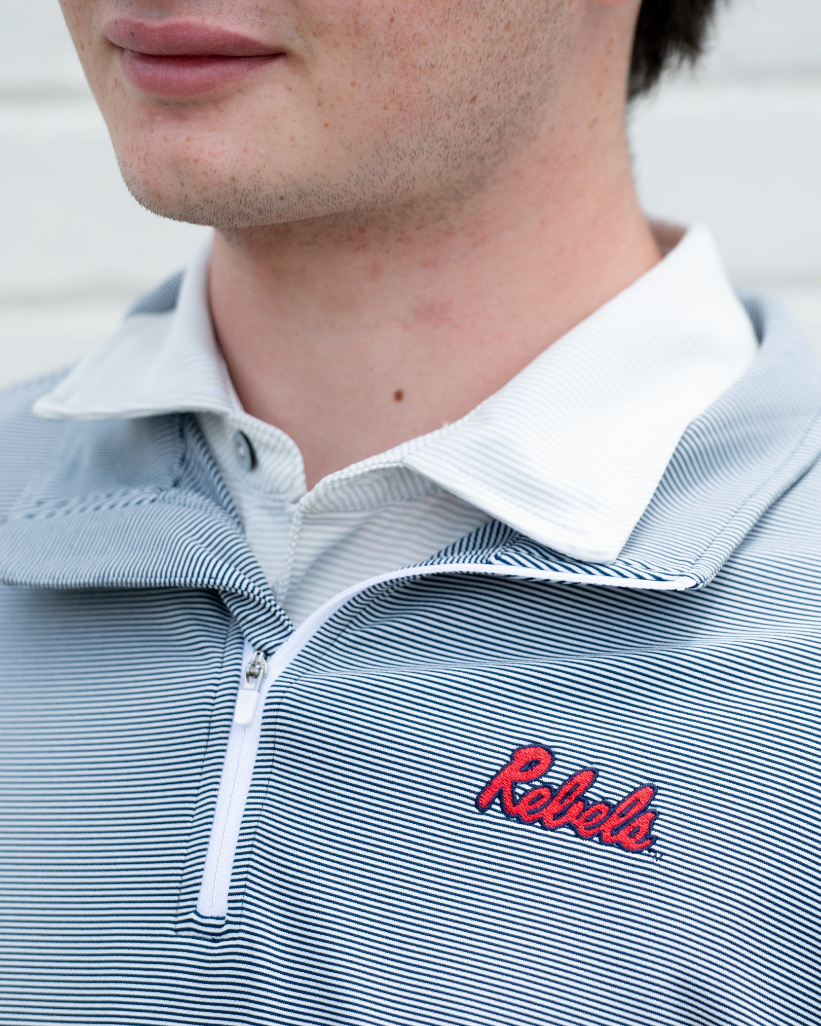Ole Miss Navy Stripe ¼ Zip Pullover with the Script “Rebels” Logo embroidery