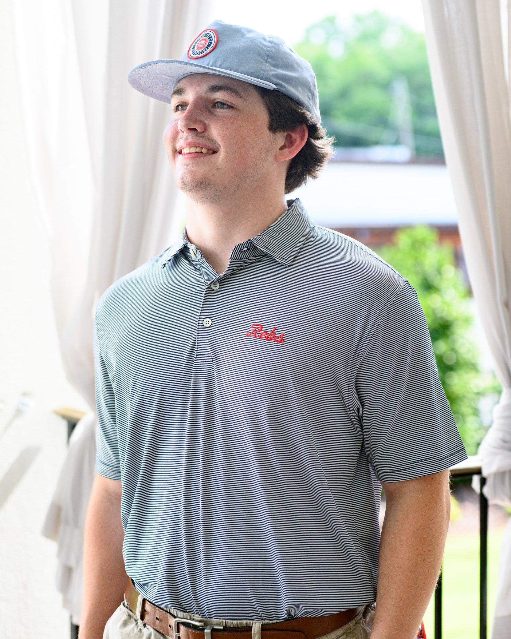 Ole Miss Navy Men’s Stripe Polo with the Script Rebs Logo embroidery
