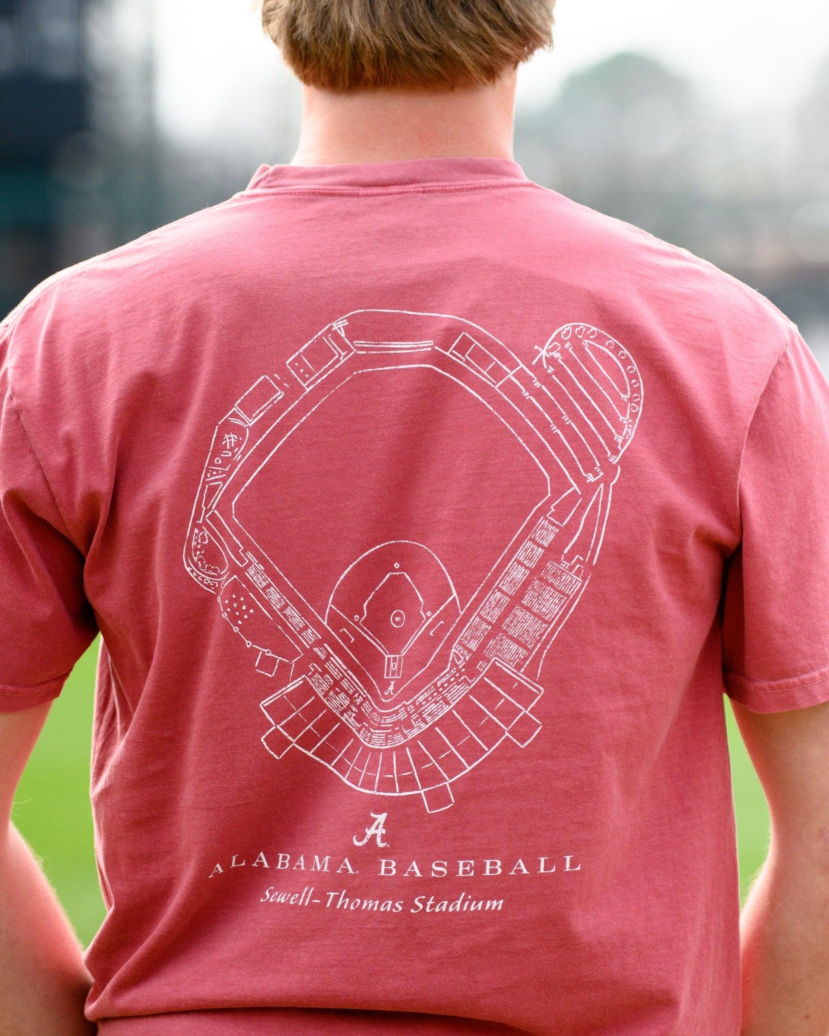 University of Alabama Red Distressed Tee with a White print of the Sewell-Thomas Stadium blueprint above text “Alabama Baseball”