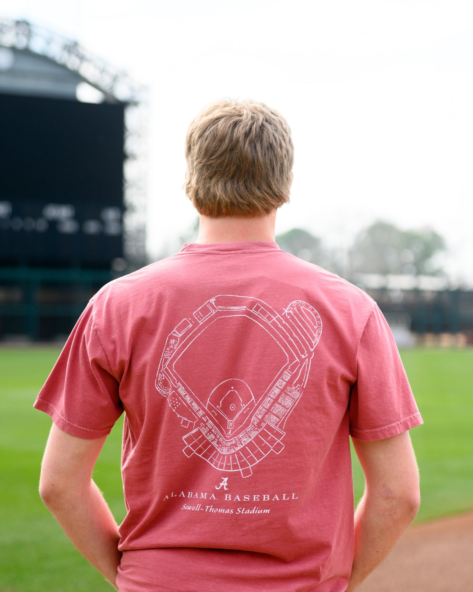 University of Alabama Red Distressed Tee with a White print of the Sewell-Thomas Stadium blueprint above text “Alabama Baseball”