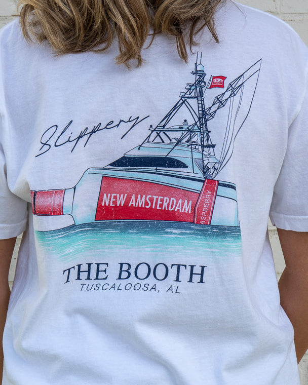 White t-shirt with a graphic of a boat and New Amsterdam branding, worn by a person.