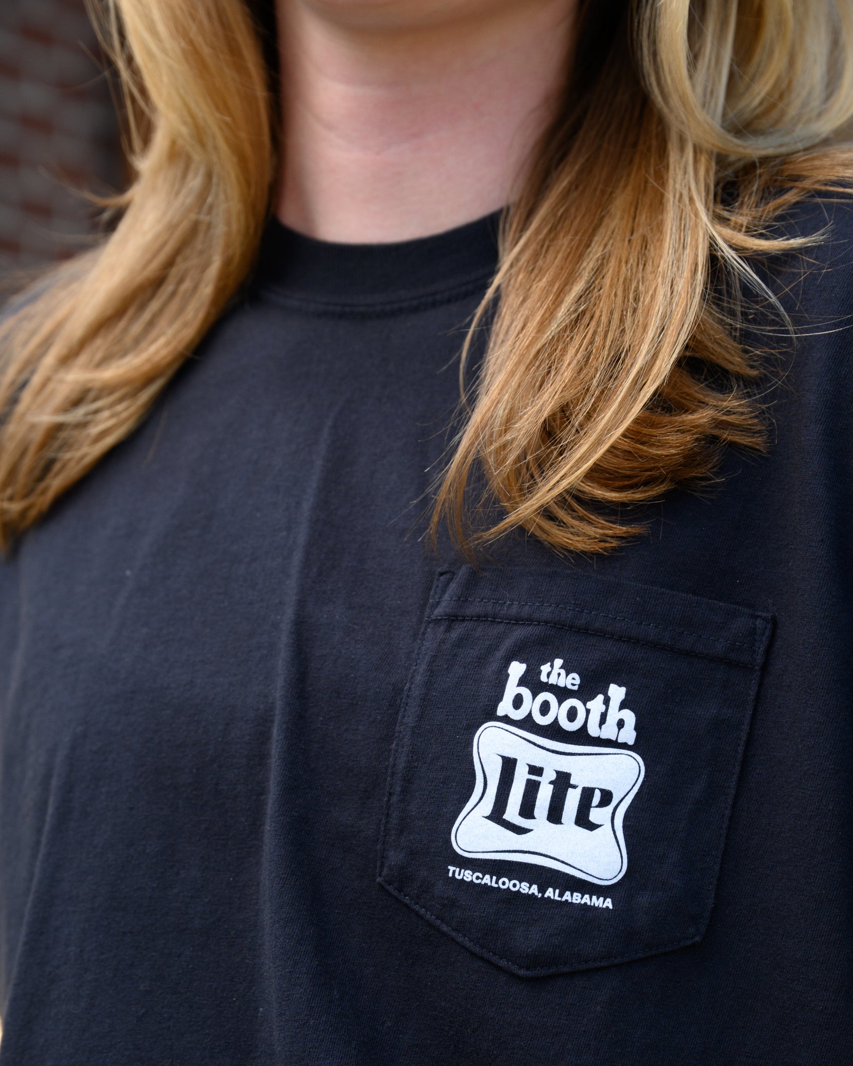 front pocket design featuring The Booth logo above the Miller Lite logo