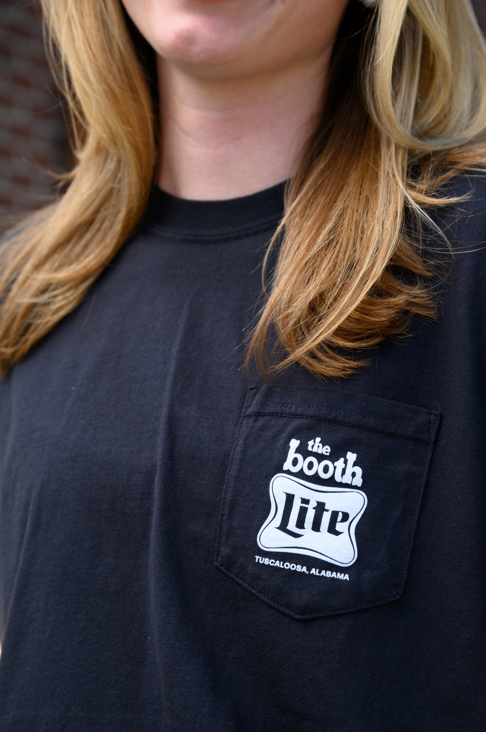 front pocket design featuring The Booth logo above the Miller Lite logo