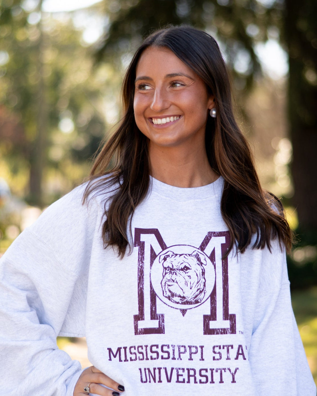 Mississippi State Light Grey Sweatshirt with the Vintage State Logo above Maroon text “Mississippi State University”