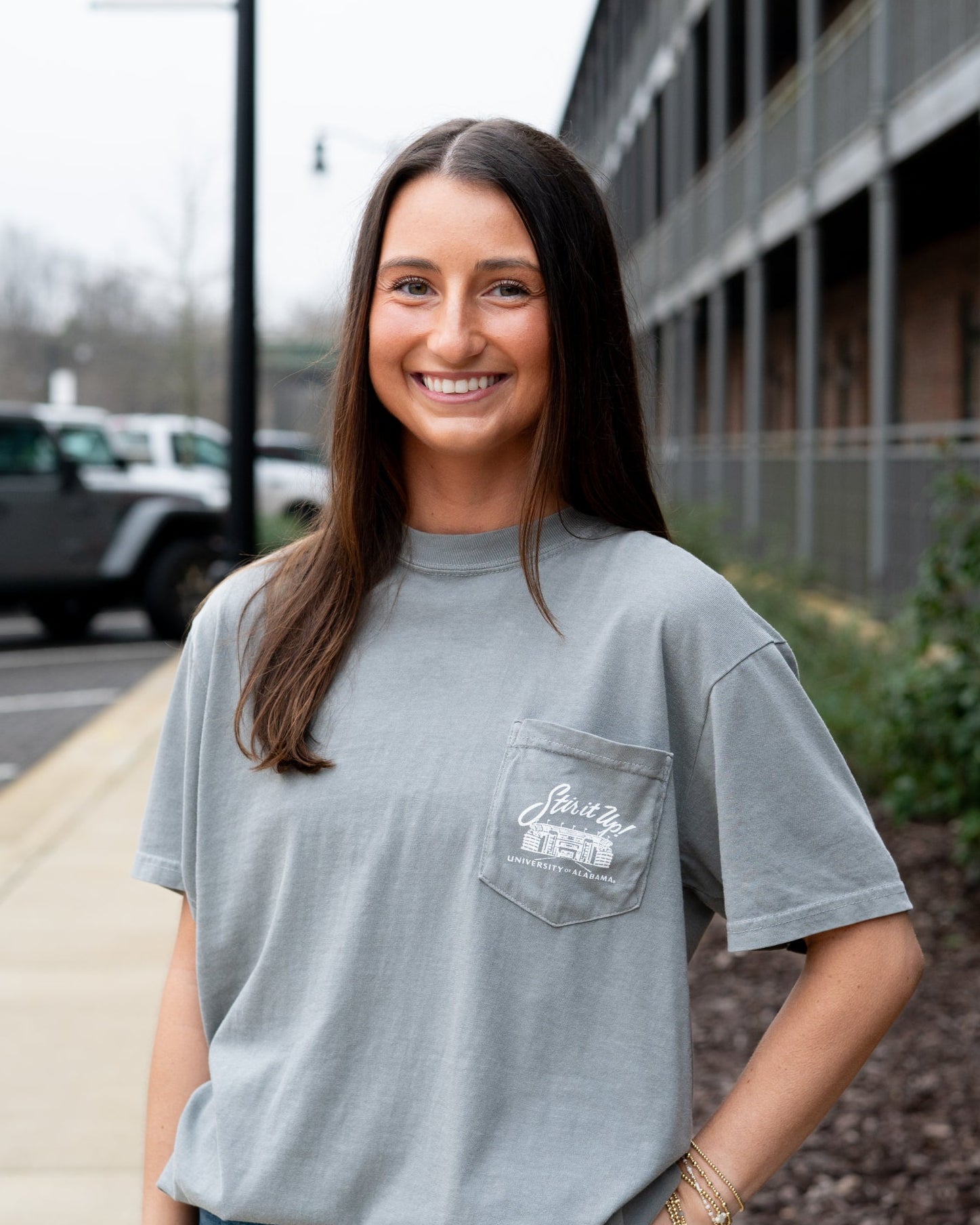 University of Alabama Grey T-Shirt Pocket Design with White text “stir it up” over the Bryant-Denny Stadium