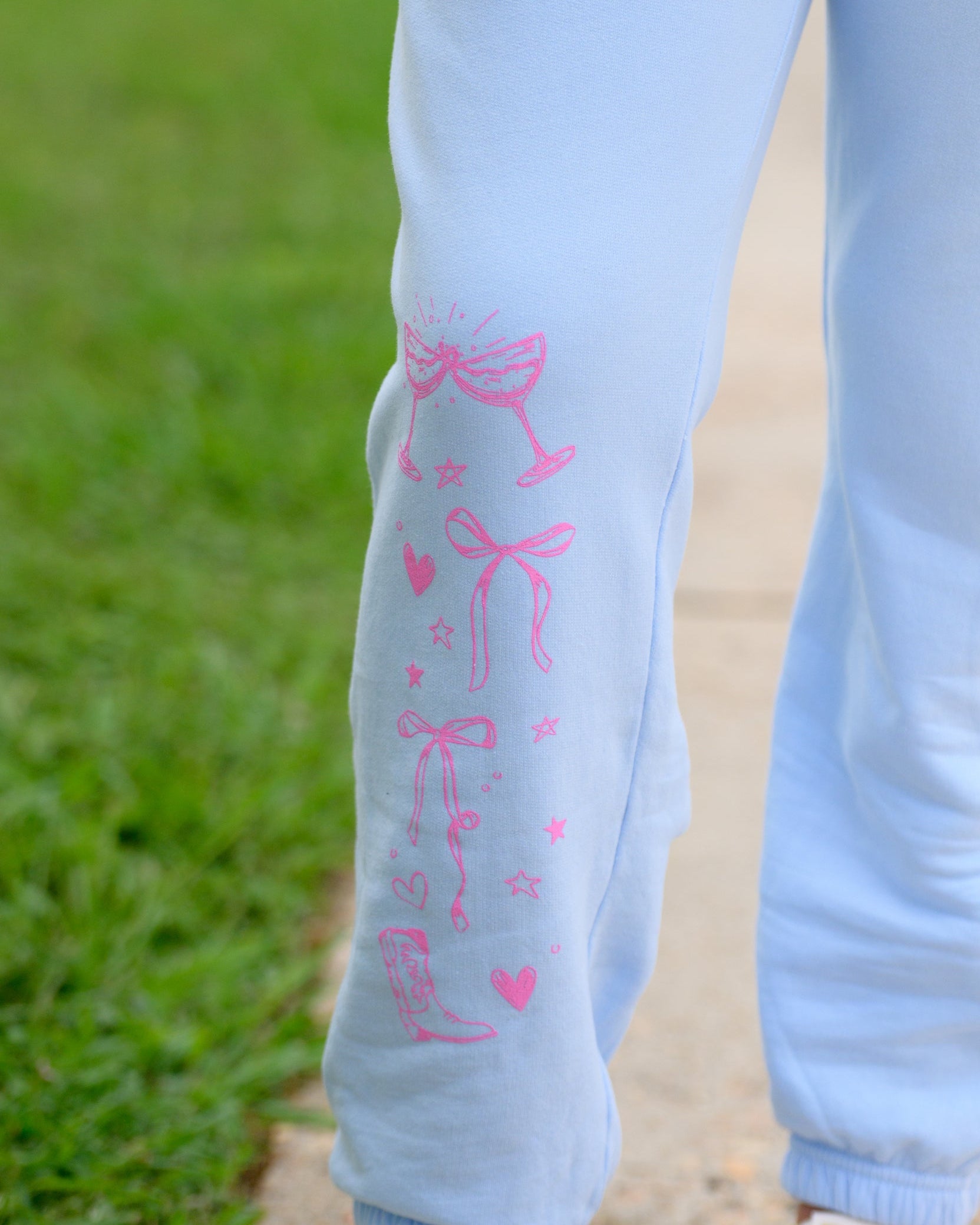 T-Town Lifestyle Sweatpants with Pink illustrations of hearts, bows, stars, etc.