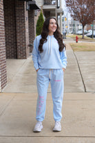 Light Blue T-Town Lifestyle Ladies' Hoodie with Pink bows hearts, and stars surrounding Pink text "T-TOWN it's a lifestyle!"