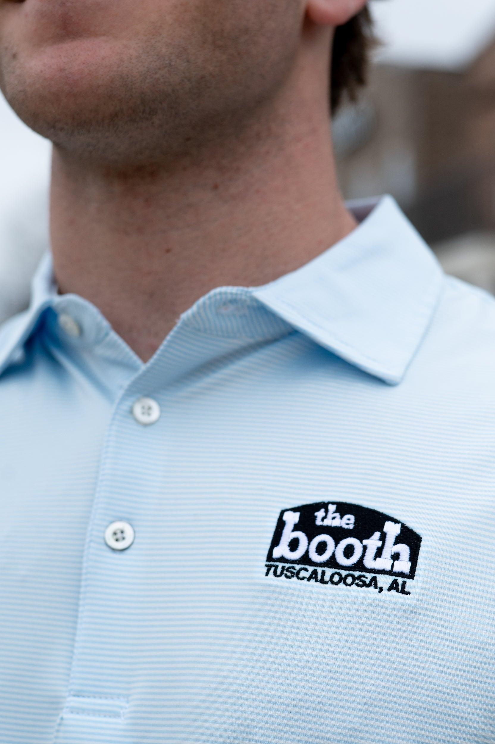 The Booth Light Blue Stripe Men’s Polo with The Booth Logo embroidered on the chest