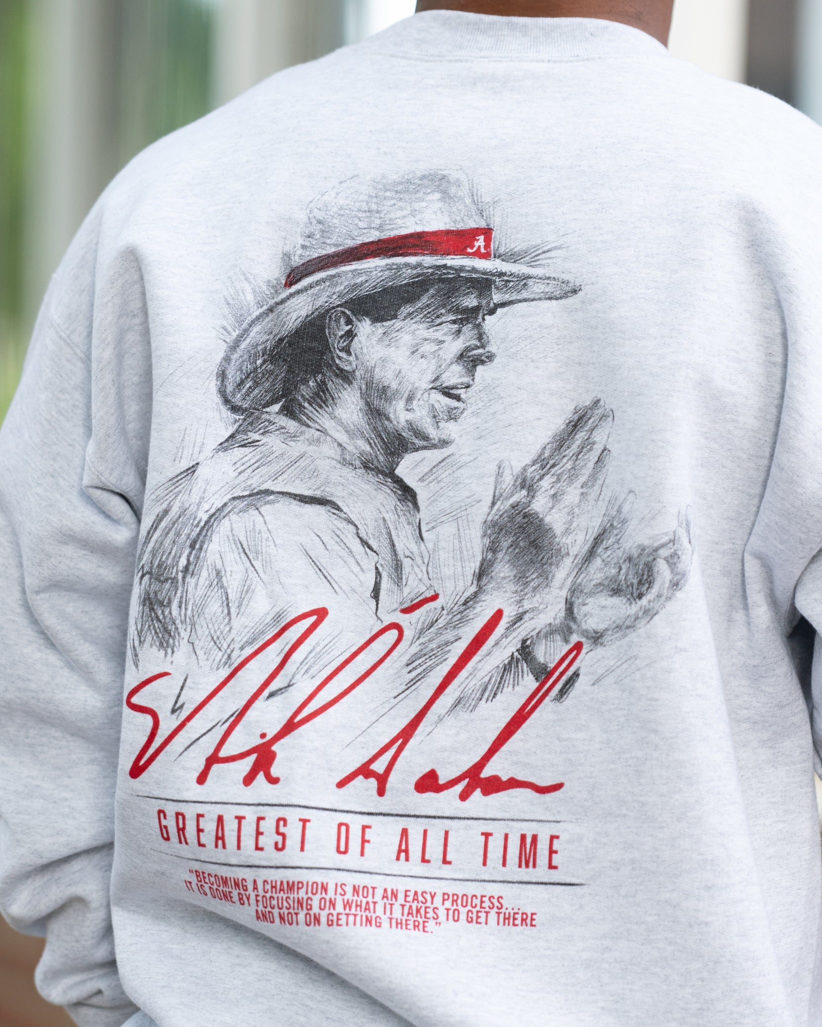 University of Alabama White Gildan Sweatshirt with an illustration of Nick Saban above his signature and Red text "Greatest Of All Time"