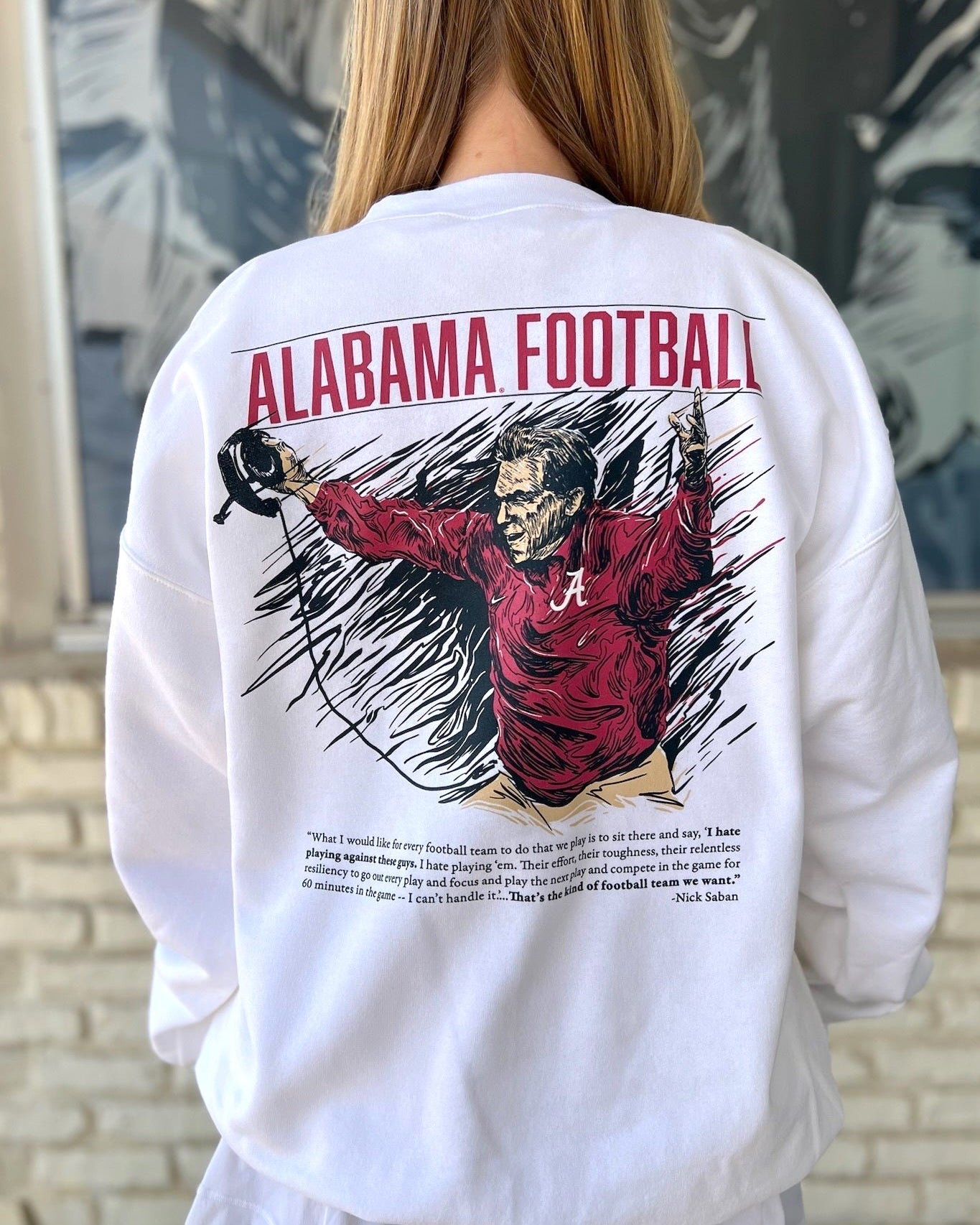 University of Alabama White The Philosophy Sweatshirt featuring an illustration of Nick Saban coaching above text reading his philosophy