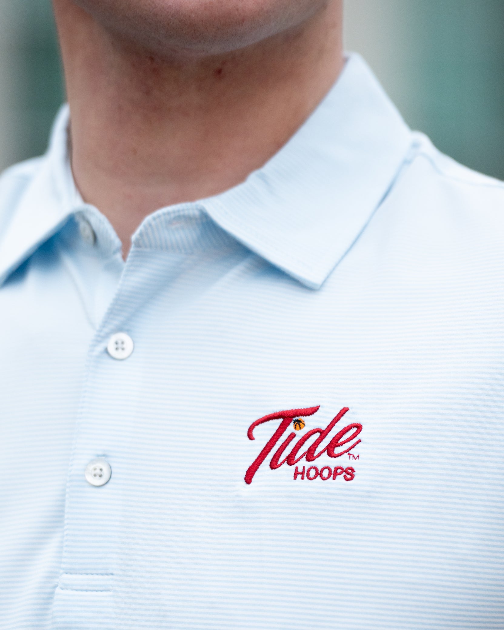University of Alabama Men’s Light Blue Stripe Polo with the Tide Hoops Logo embroidered on the chest