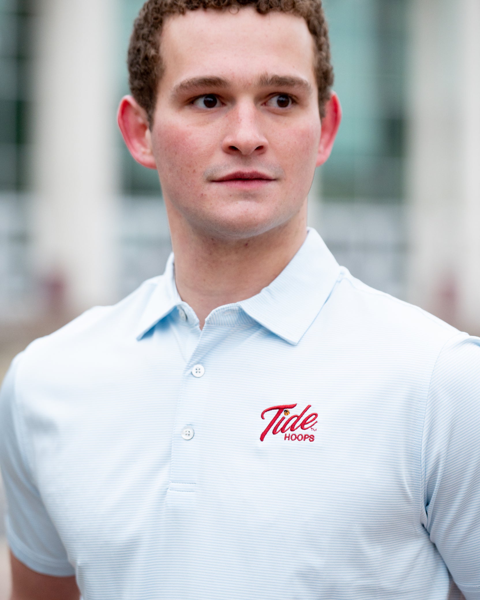 University of Alabama Men’s Light Blue Stripe Polo with the Tide Hoops Logo embroidered on the chest