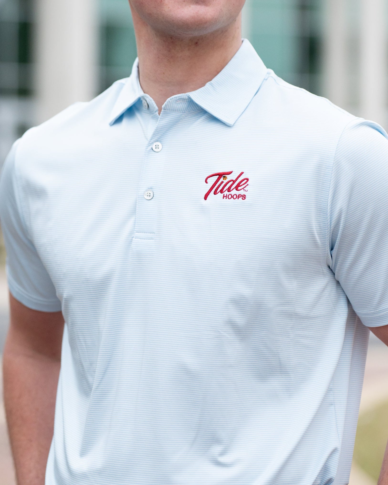 University of Alabama Men’s Light Blue Stripe Polo with the Tide Hoops Logo embroidered on the chest
