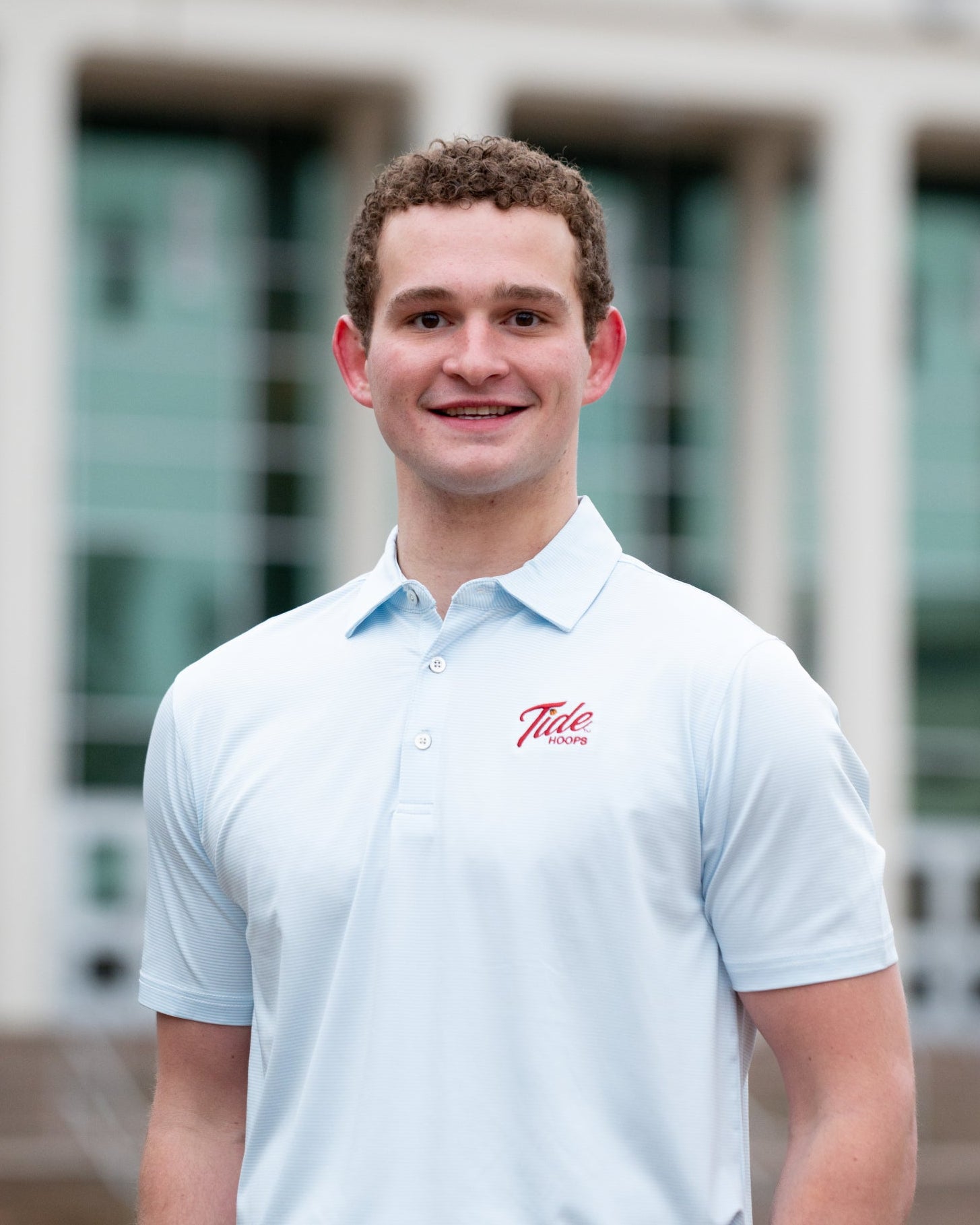 University of Alabama Men’s Light Blue Stripe Polo with the Tide Hoops Logo embroidered on the chest