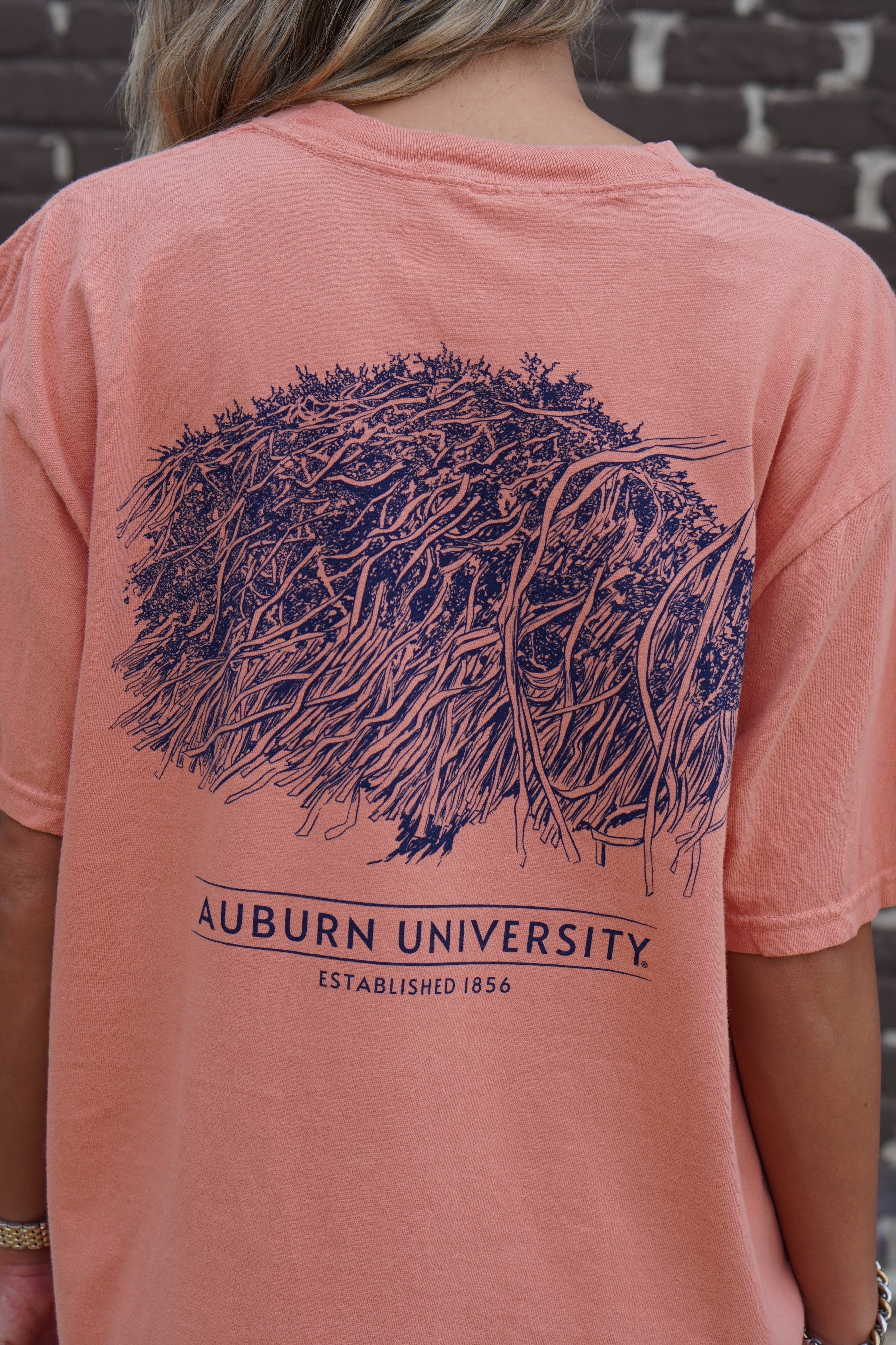 Auburn University Orange Toomer's Tree T-Shirt featuring an illustration of a rolled tree from Toomer's Corner