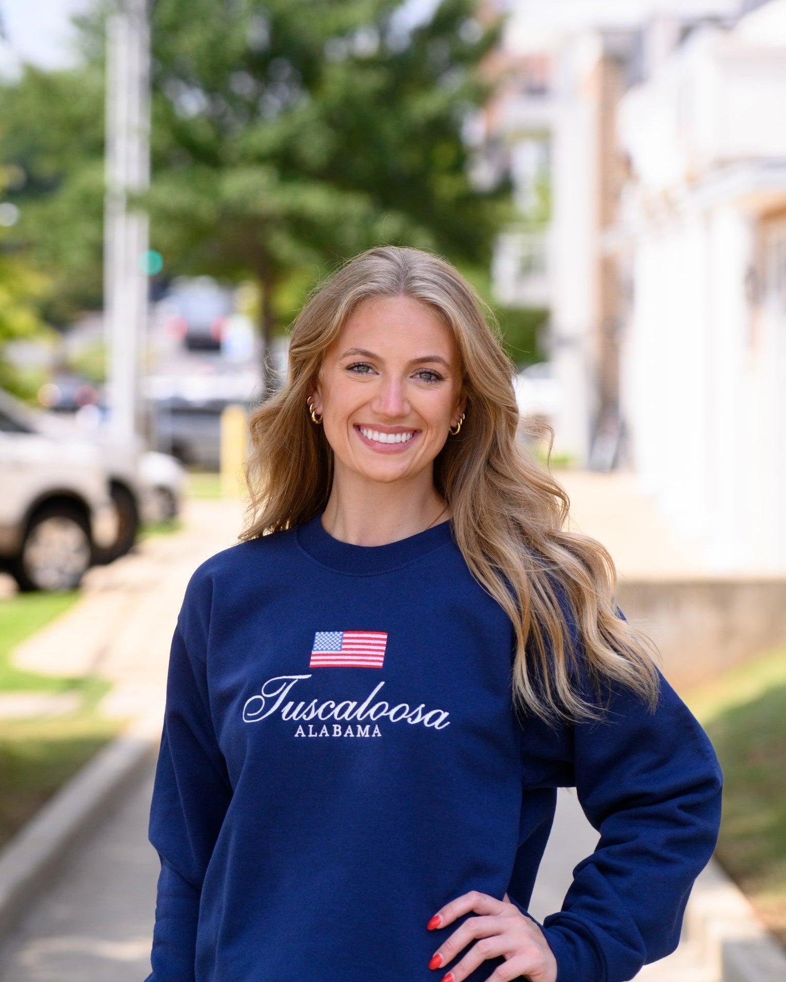 Navy Crewneck with an American Flag above White text “Tuscaloosa Alabama”