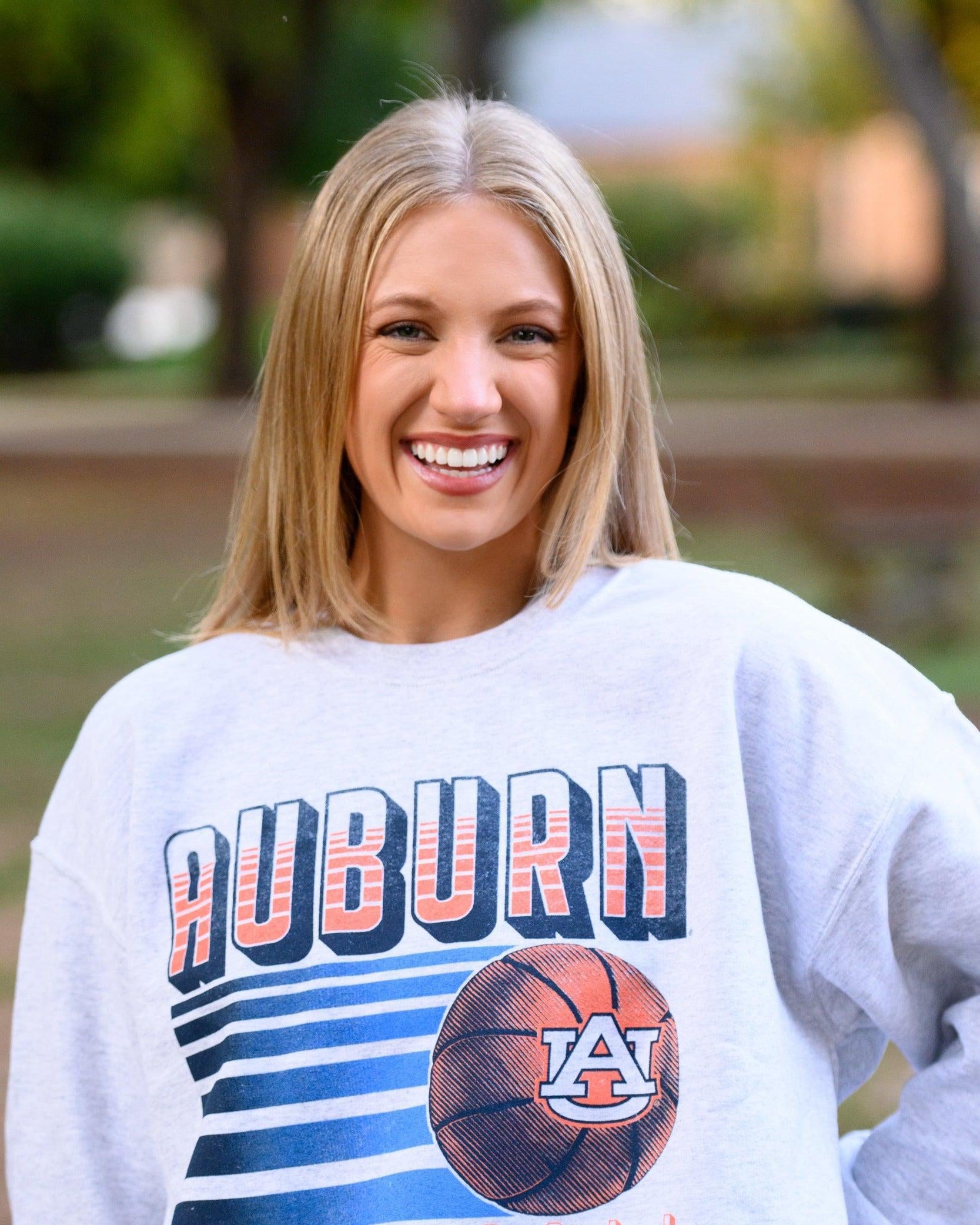 Auburn University Auburn Basketball Vintage White Gildan Sweatshirt with retro style Orange text "Auburn" and an image of a basketball with the AU Logo
