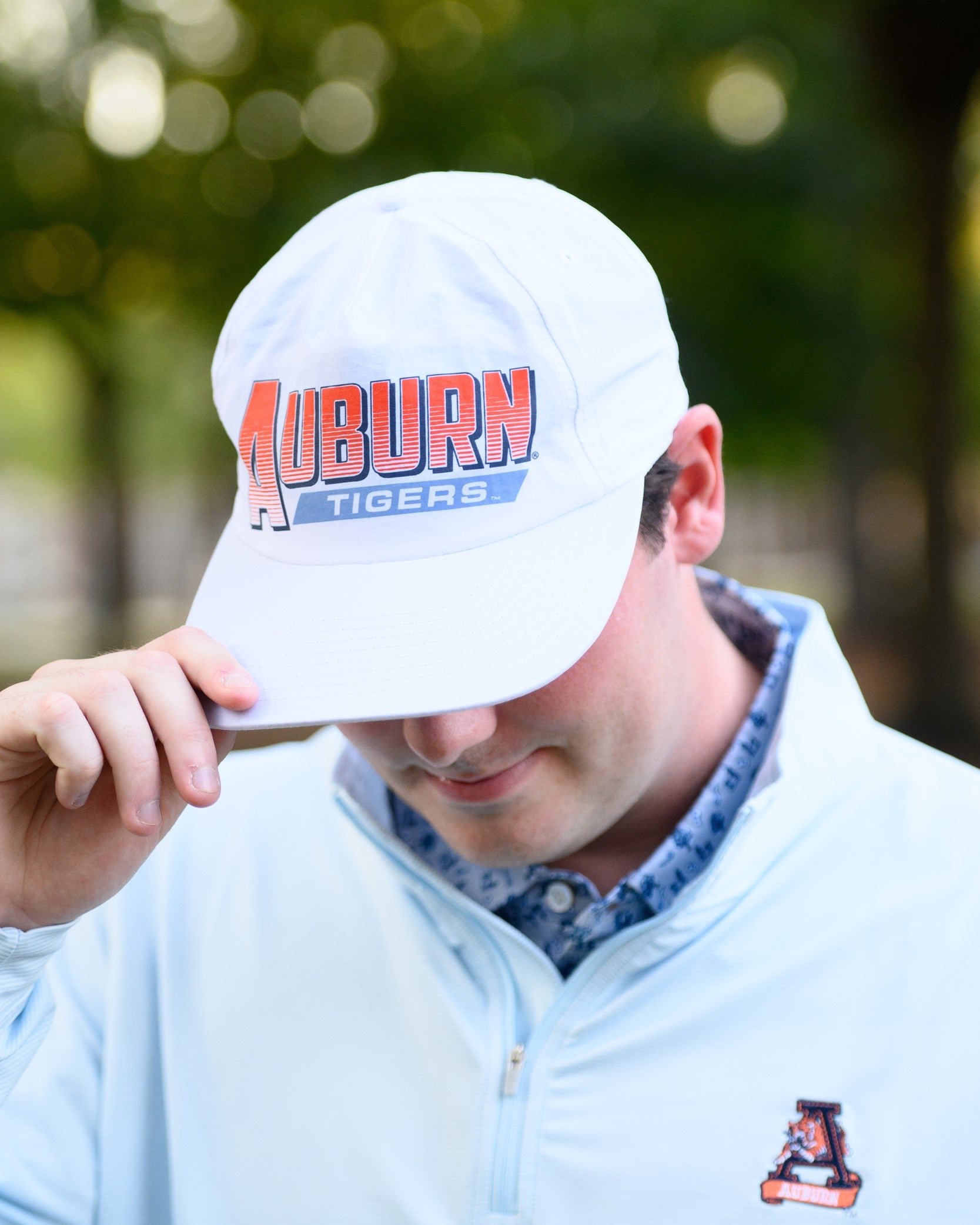 Auburn University White Hat with Orange text "Auburn" above a Blue Stripe with White text "Tigers"