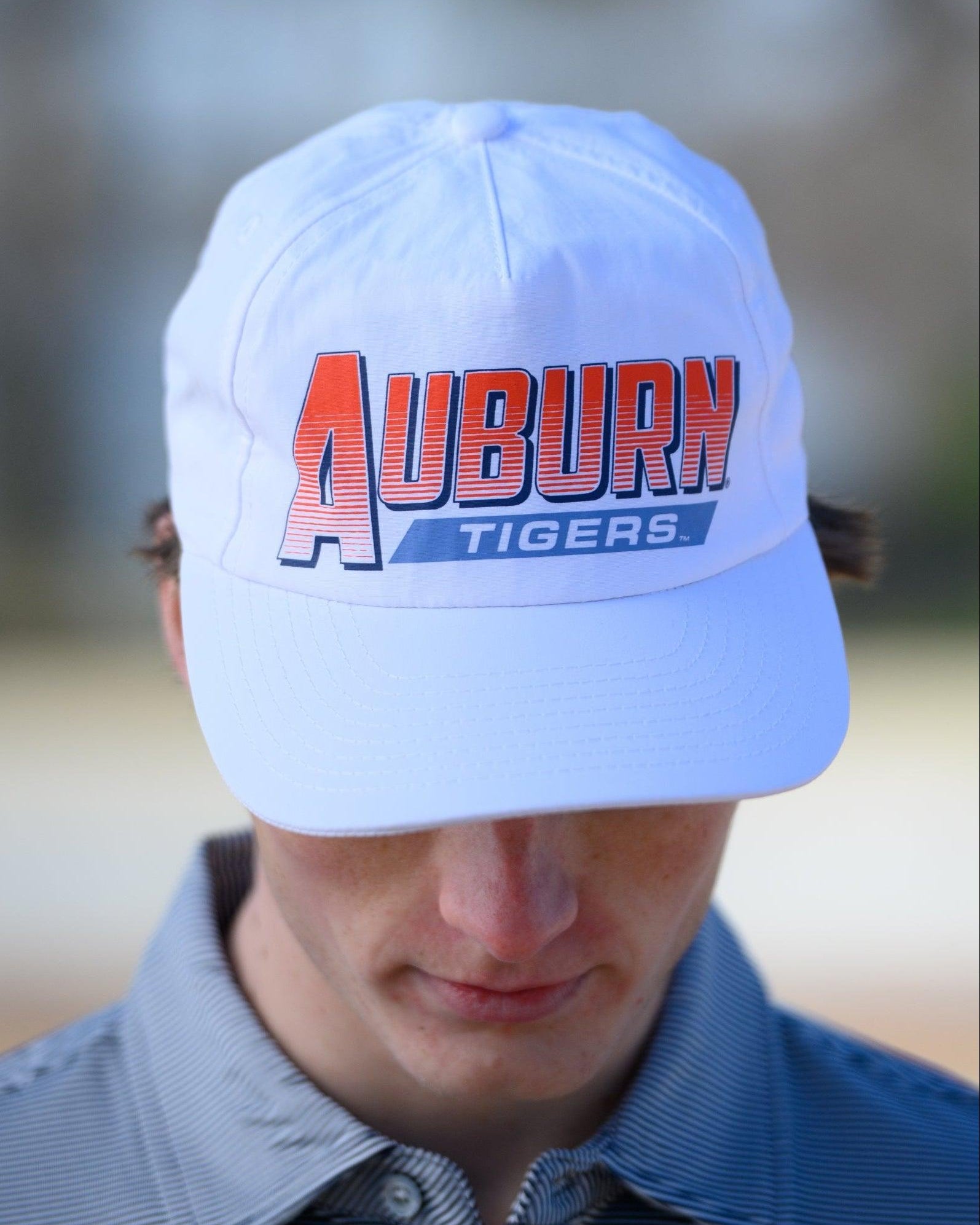 Auburn University White Hat with Orange text "Auburn" above a Blue Stripe with White text "Tigers"