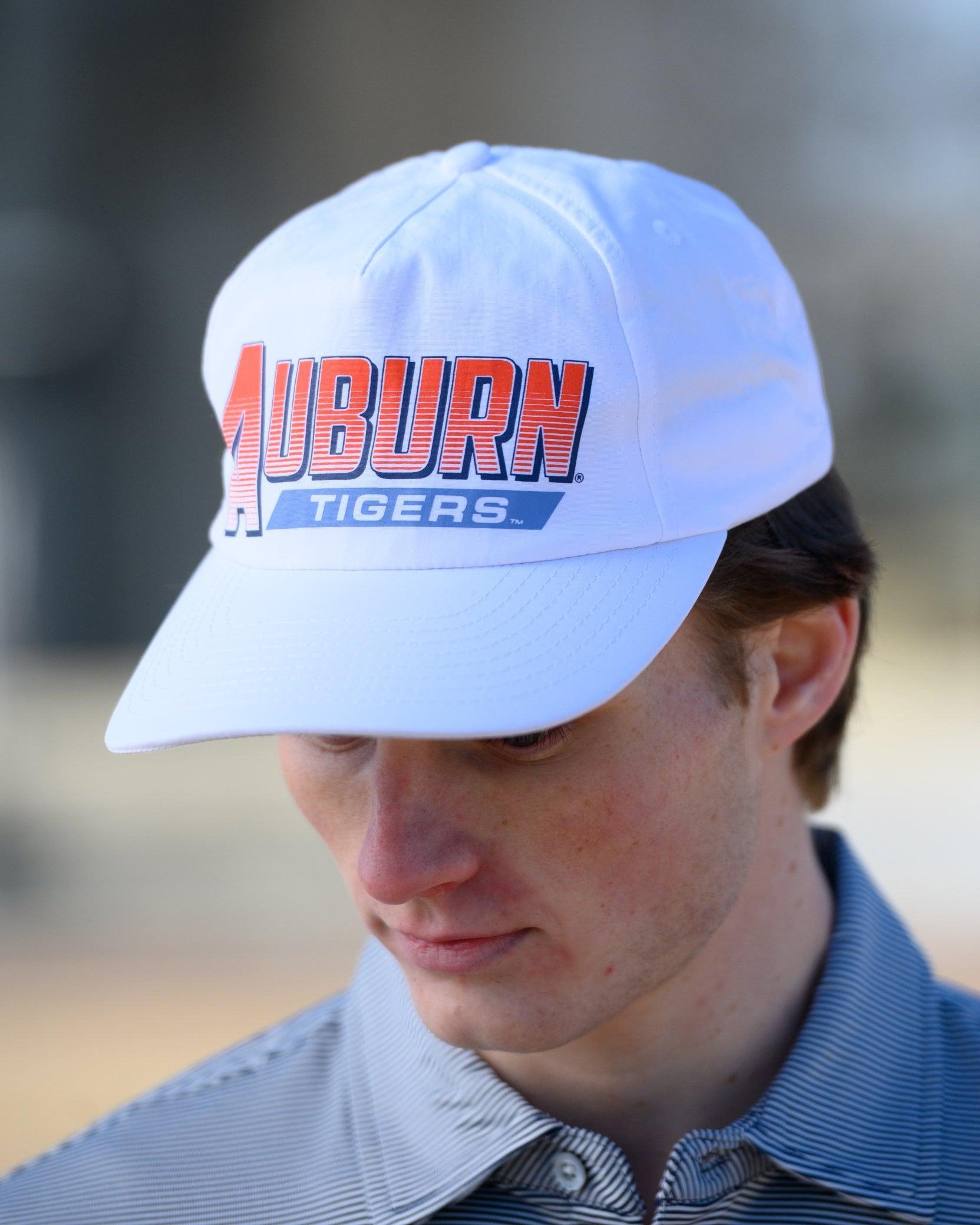 Auburn University White Hat with Orange text "Auburn" above a Blue Stripe with White text "Tigers"