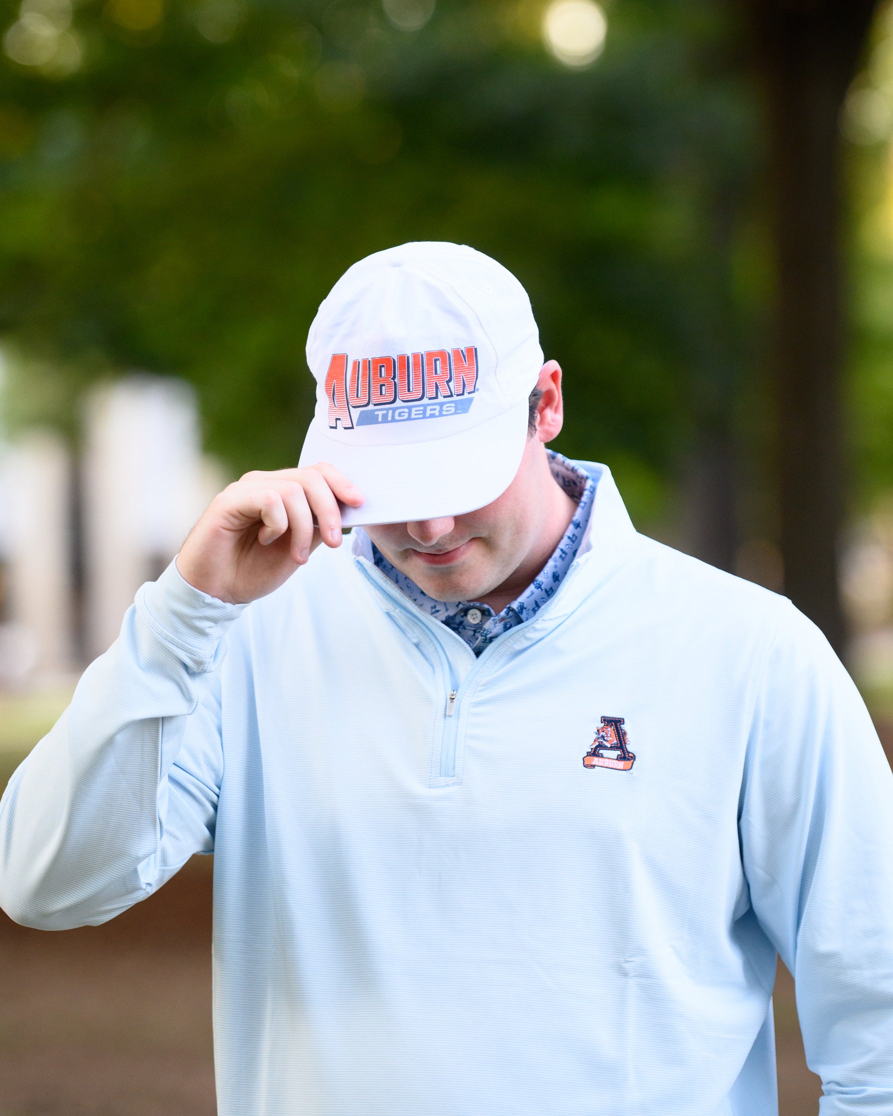 Auburn University White Hat with Orange text "Auburn" above a Blue Stripe with White text "Tigers"