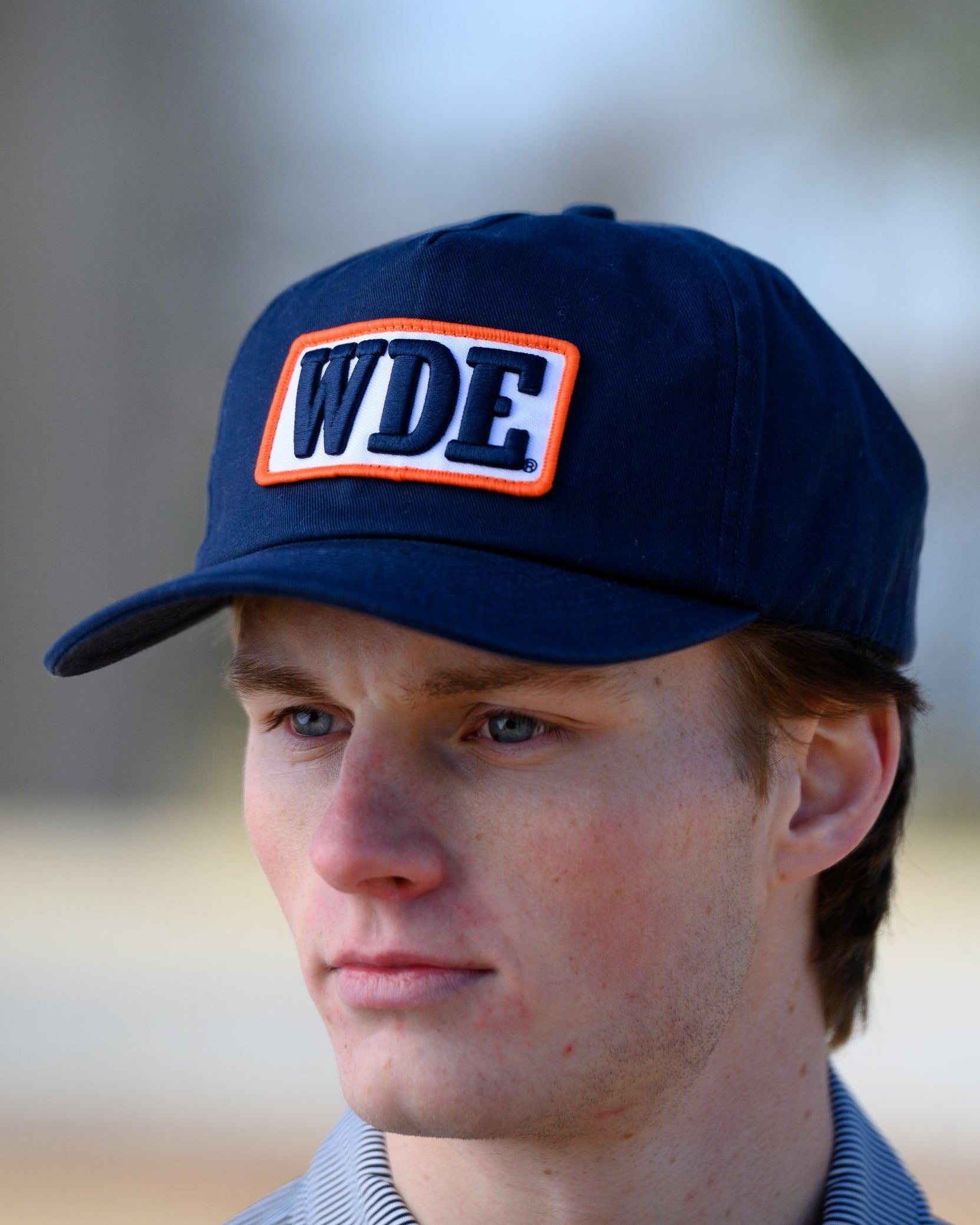 Auburn University Blue Snapback Hat featuring a White patch with Navy letters "WDE"