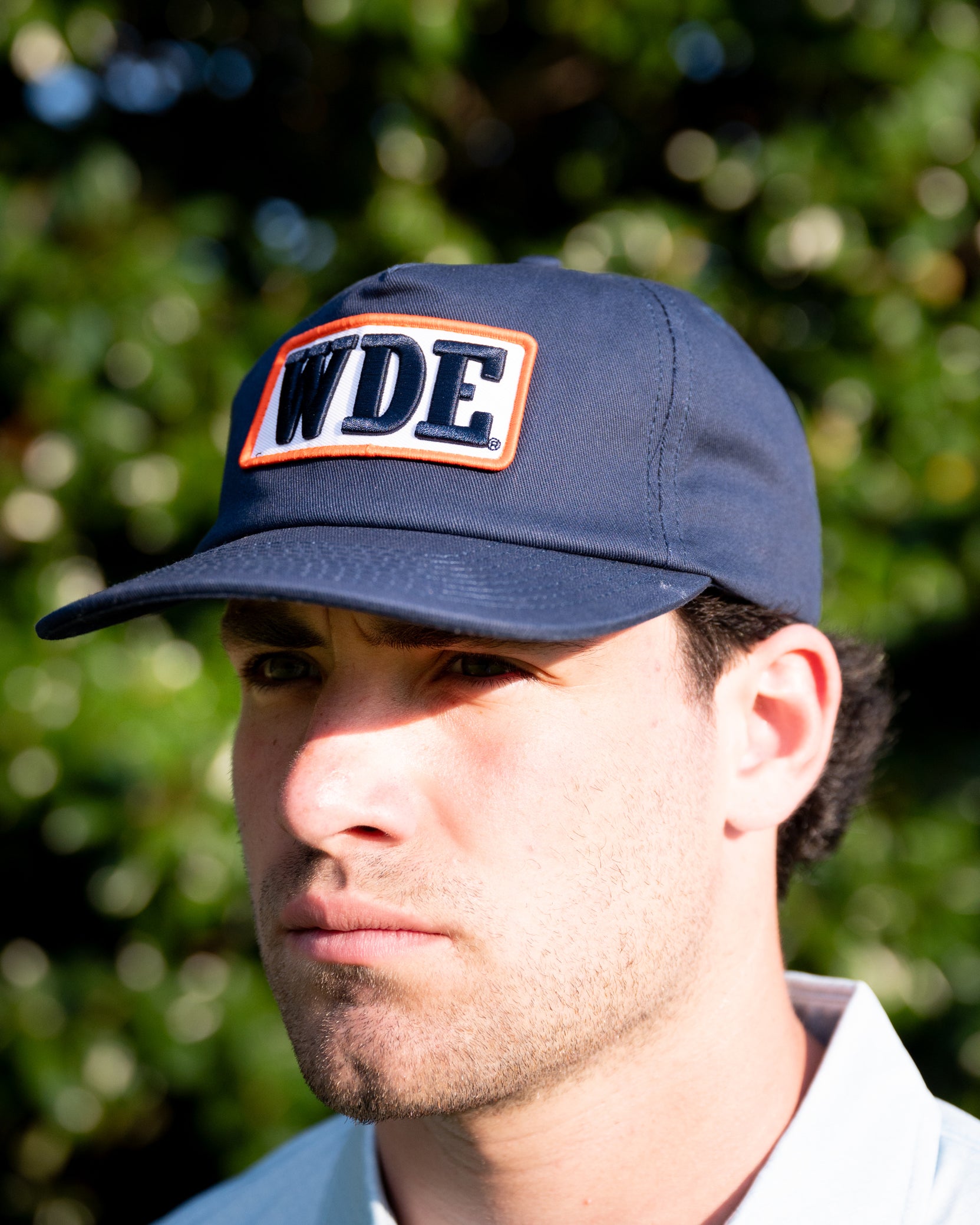 Auburn University Blue Snapback Hat featuring a White patch with Navy letters "WDE"