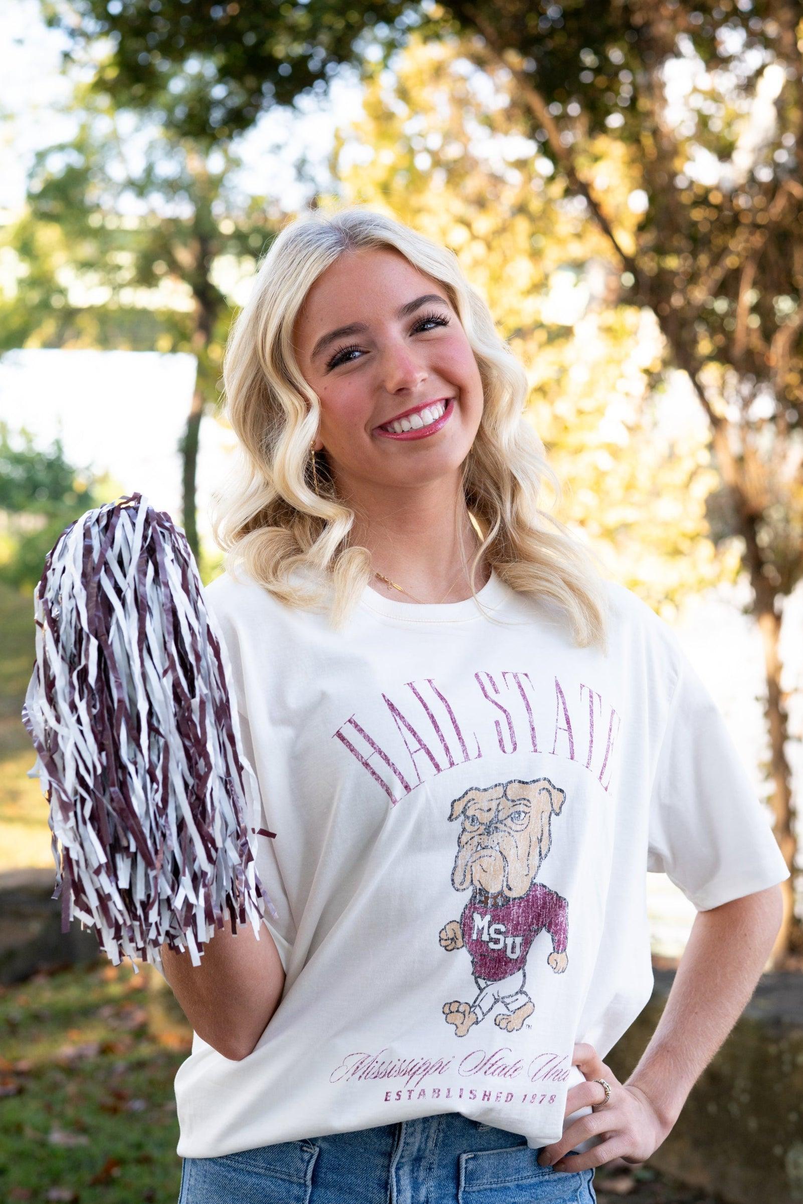 Mississippi State Ivory T-Shirt with Red text “Hail State” above an image of the Walking Bully Logo