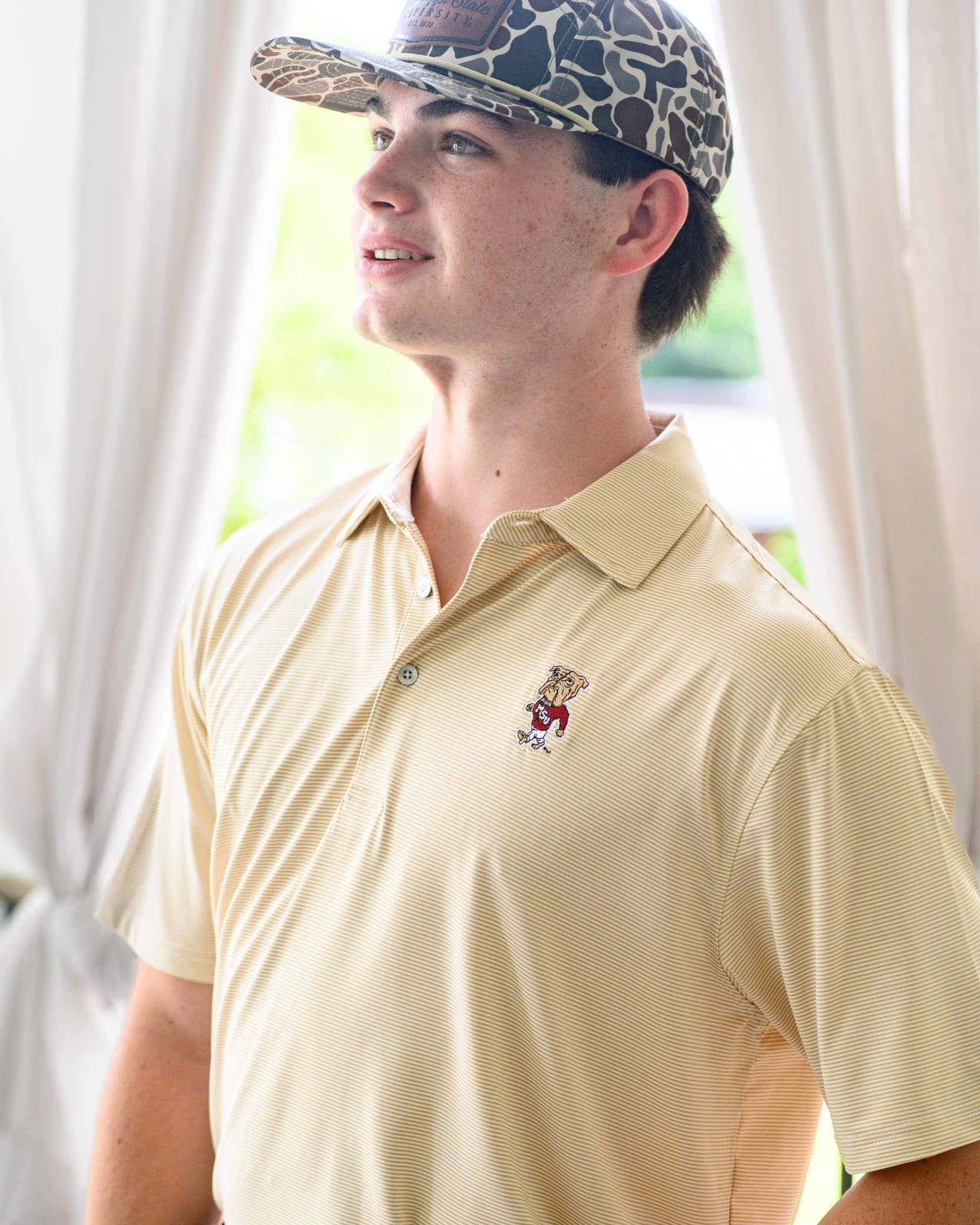 Mississippi State Tan Men’s Stripe Polo with the Walking Bully Logo embroidery