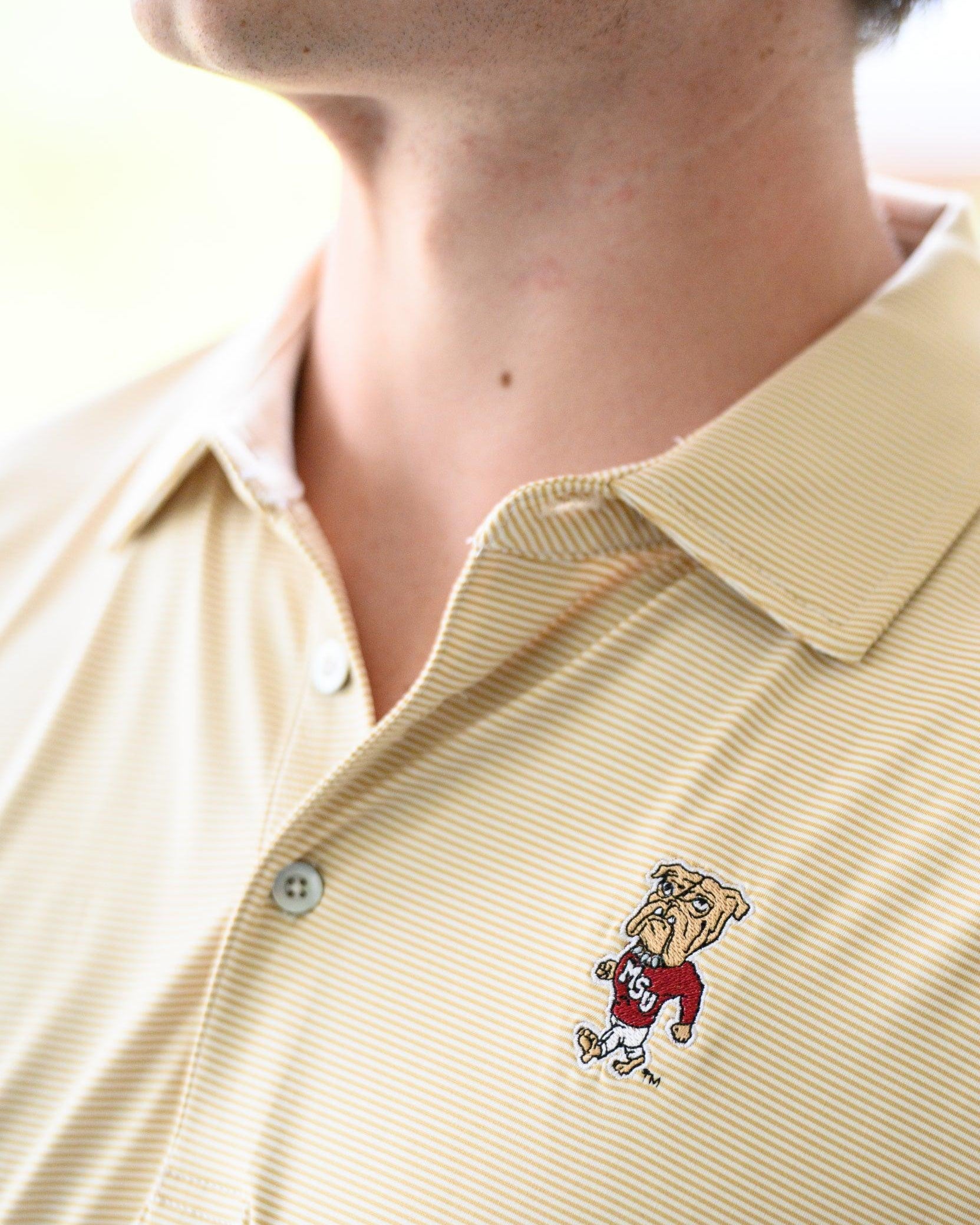 Mississippi State Tan Men’s Stripe Polo with the Walking Bully Logo embroidery