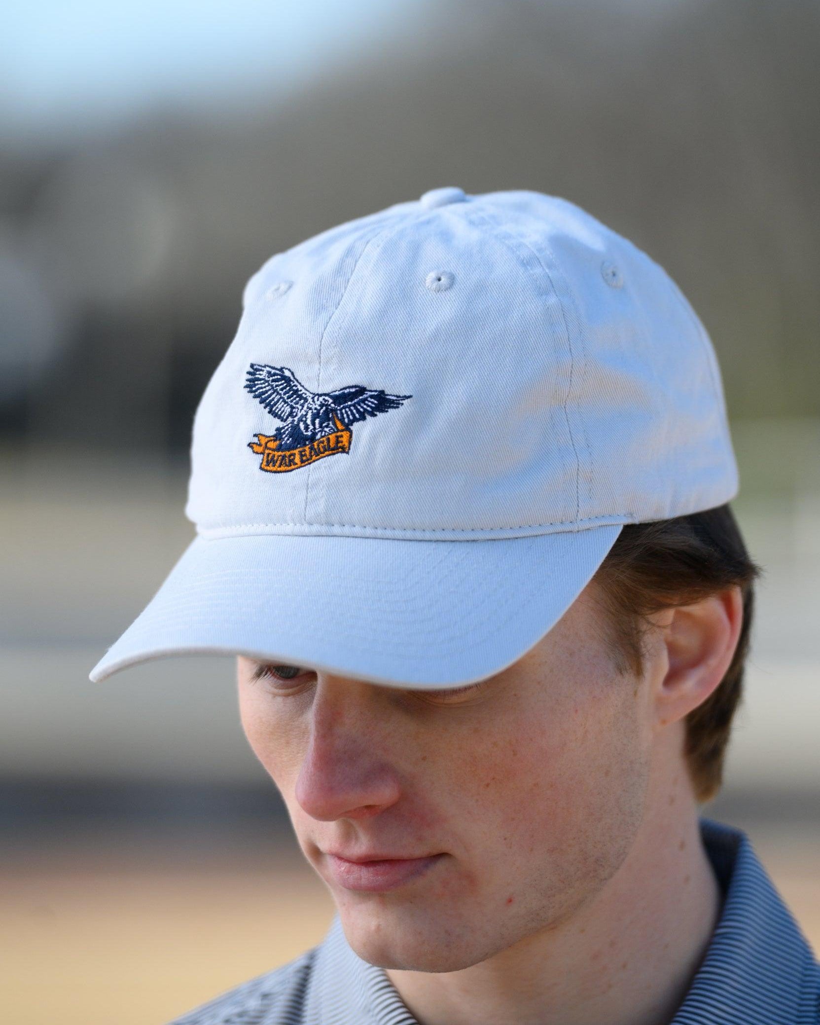 Auburn University White Dad Hat with a blue embroidered logo of the War Eagle Banner.