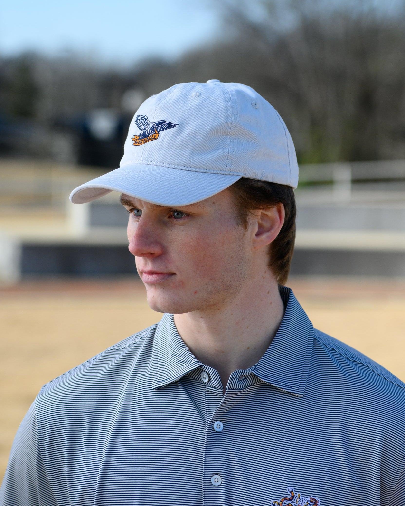 Auburn University White Dad Hat with a blue embroidered logo of the War Eagle Banner.