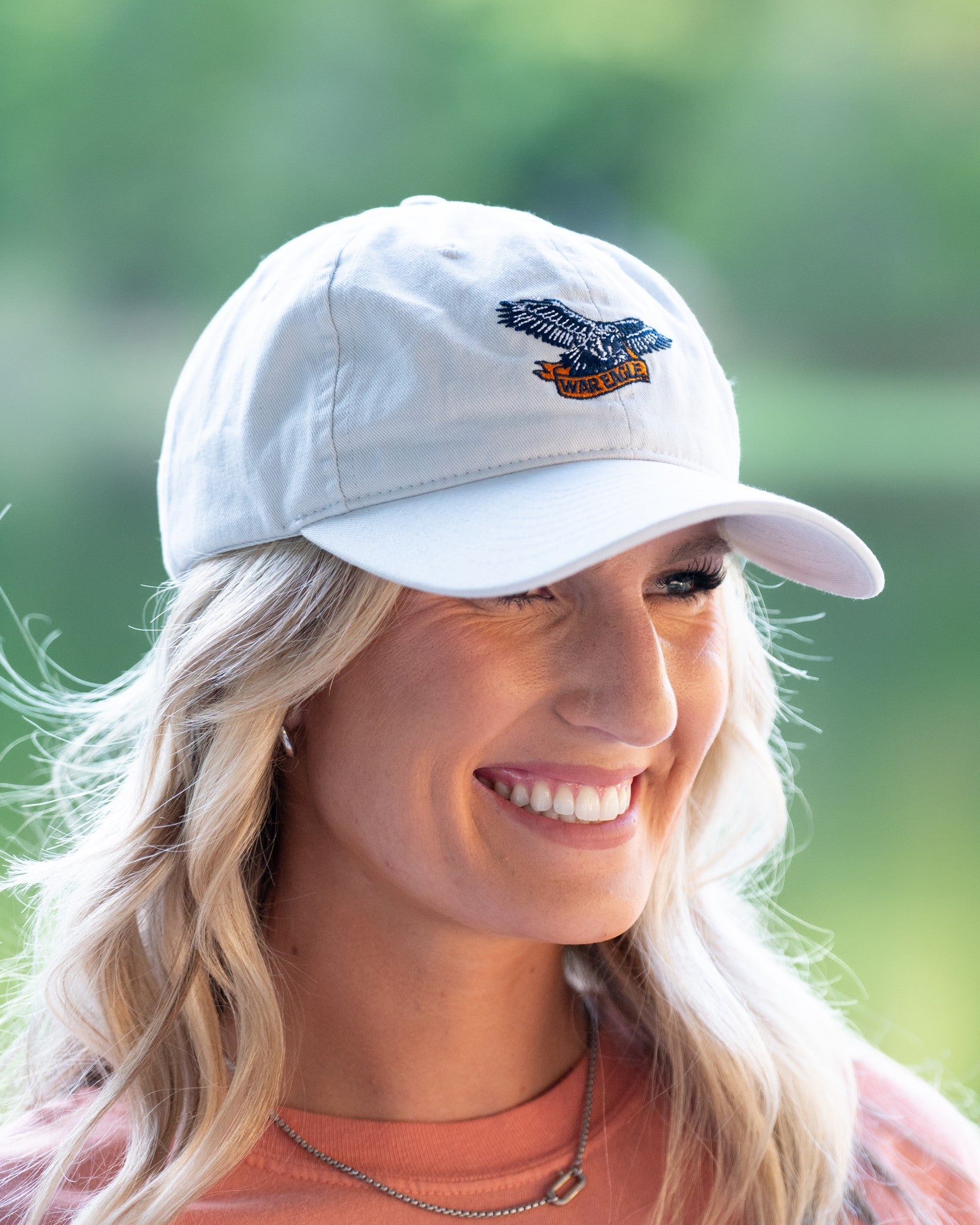 Auburn University White Dad Hat with a blue embroidered logo of the War Eagle Banner.