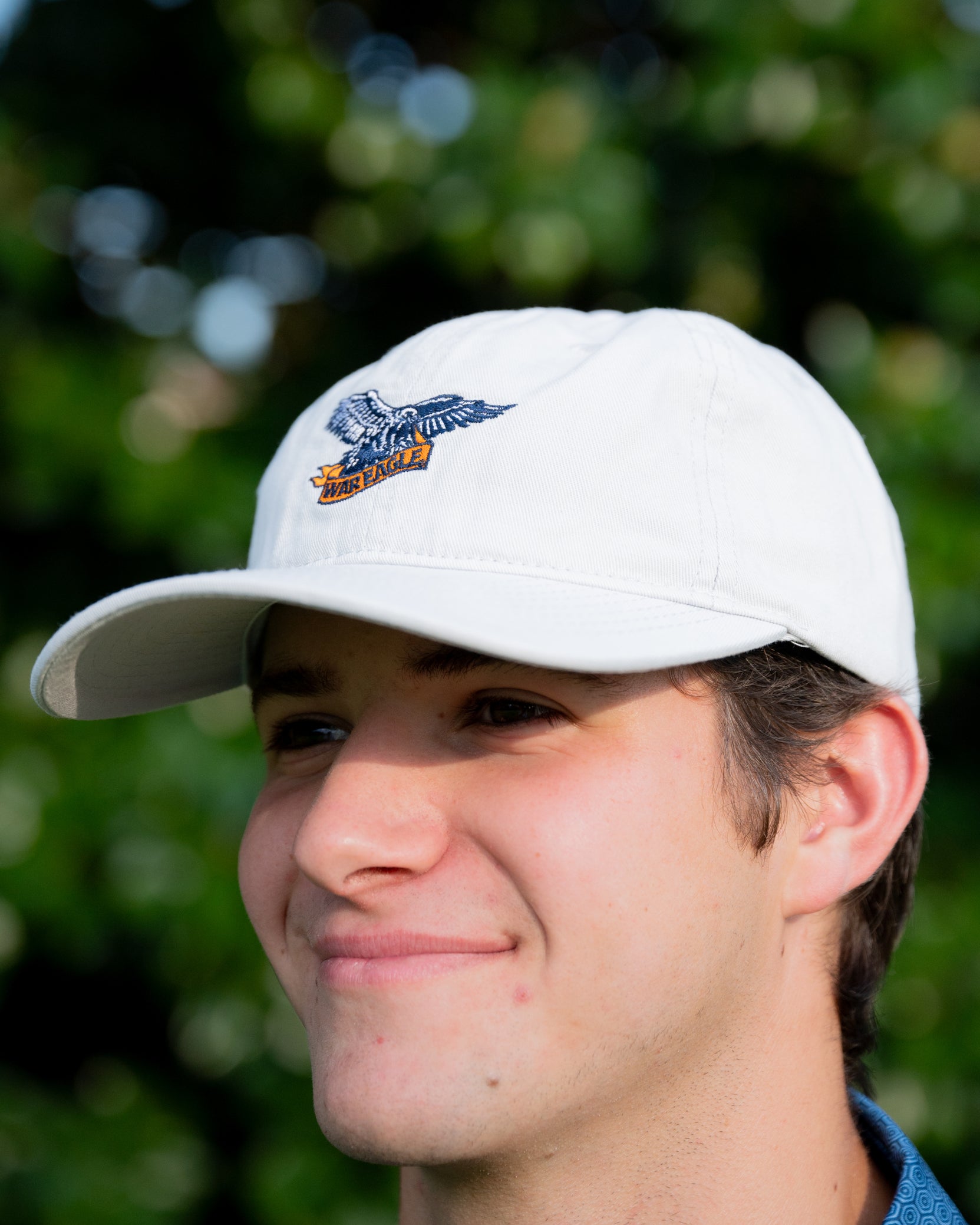 Auburn University White Dad Hat with a blue embroidered logo of the War Eagle Banner.