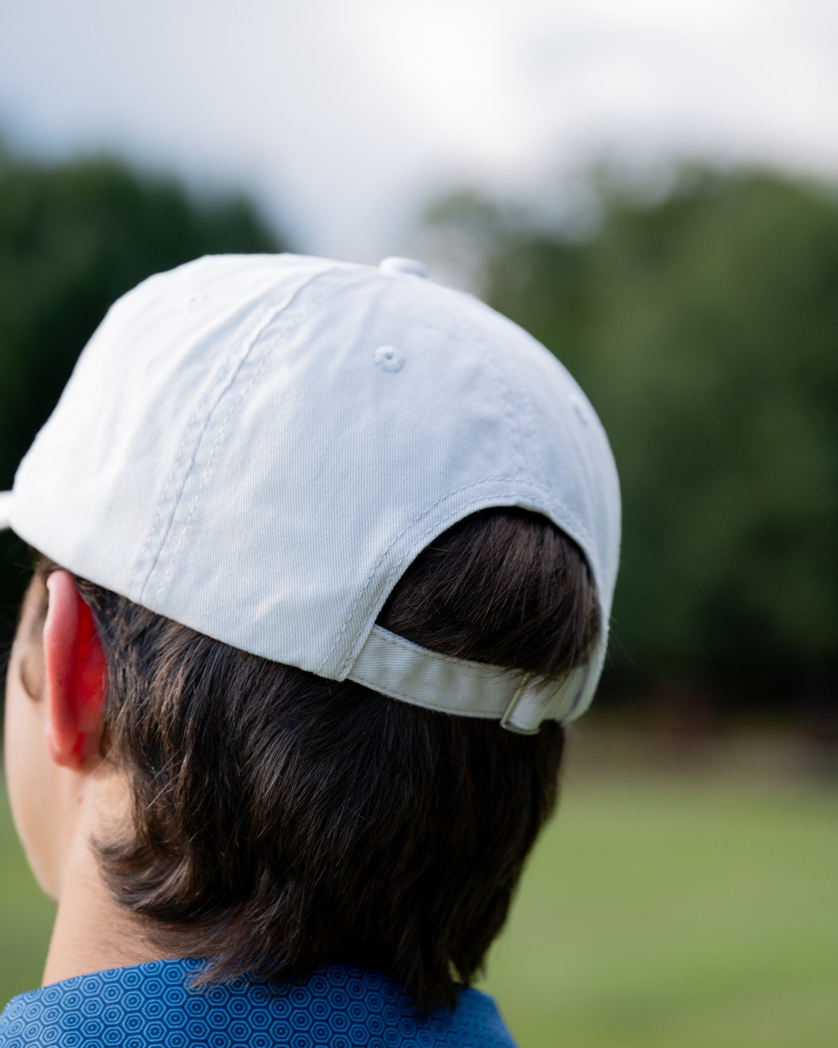 Auburn University White Dad Hat with a blue embroidered logo of the War Eagle Banner.